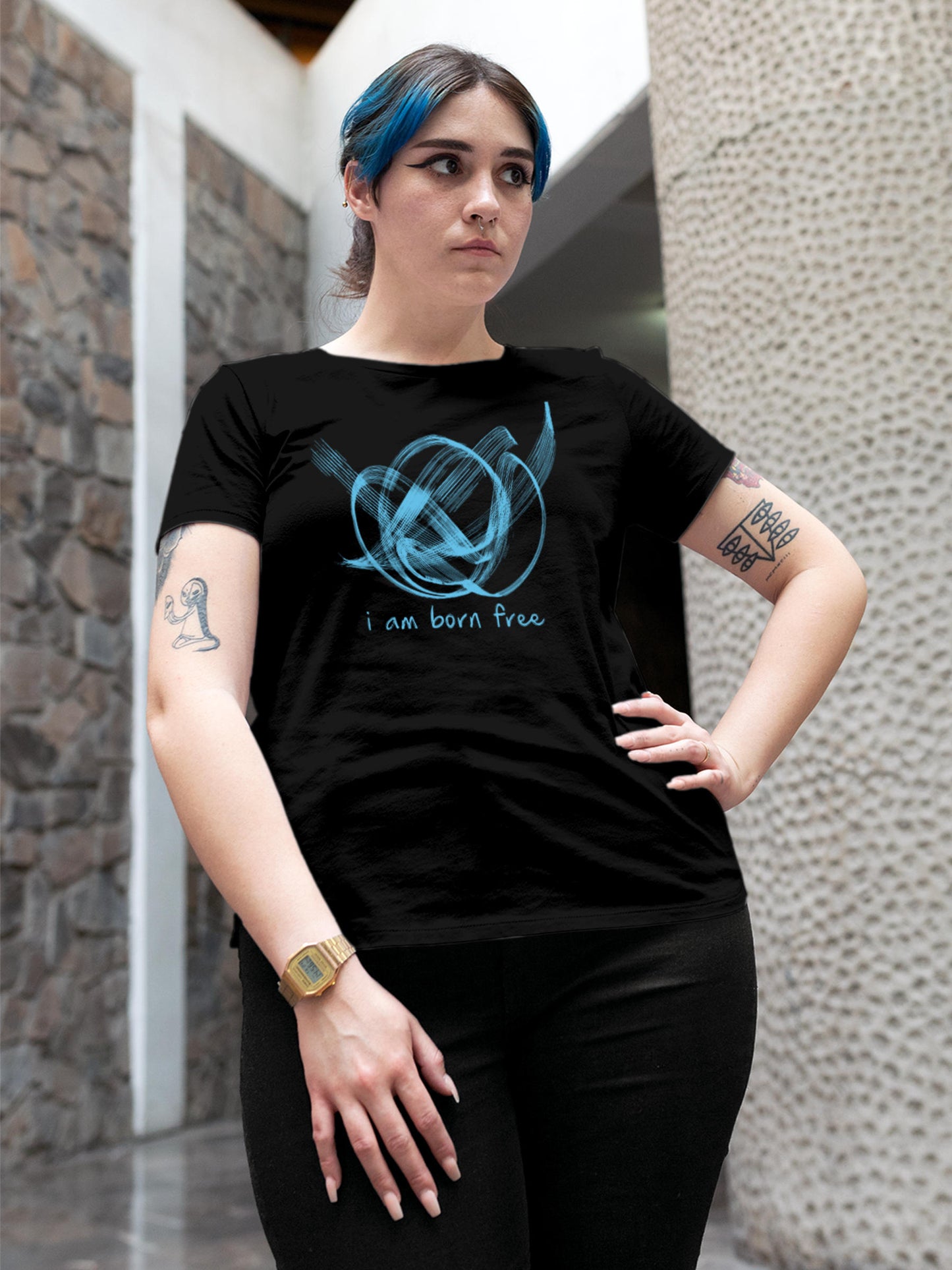 Model wearing Women's Black Round Neck T-shirt with 'Born Free' design, offering effortless style and premium comfort