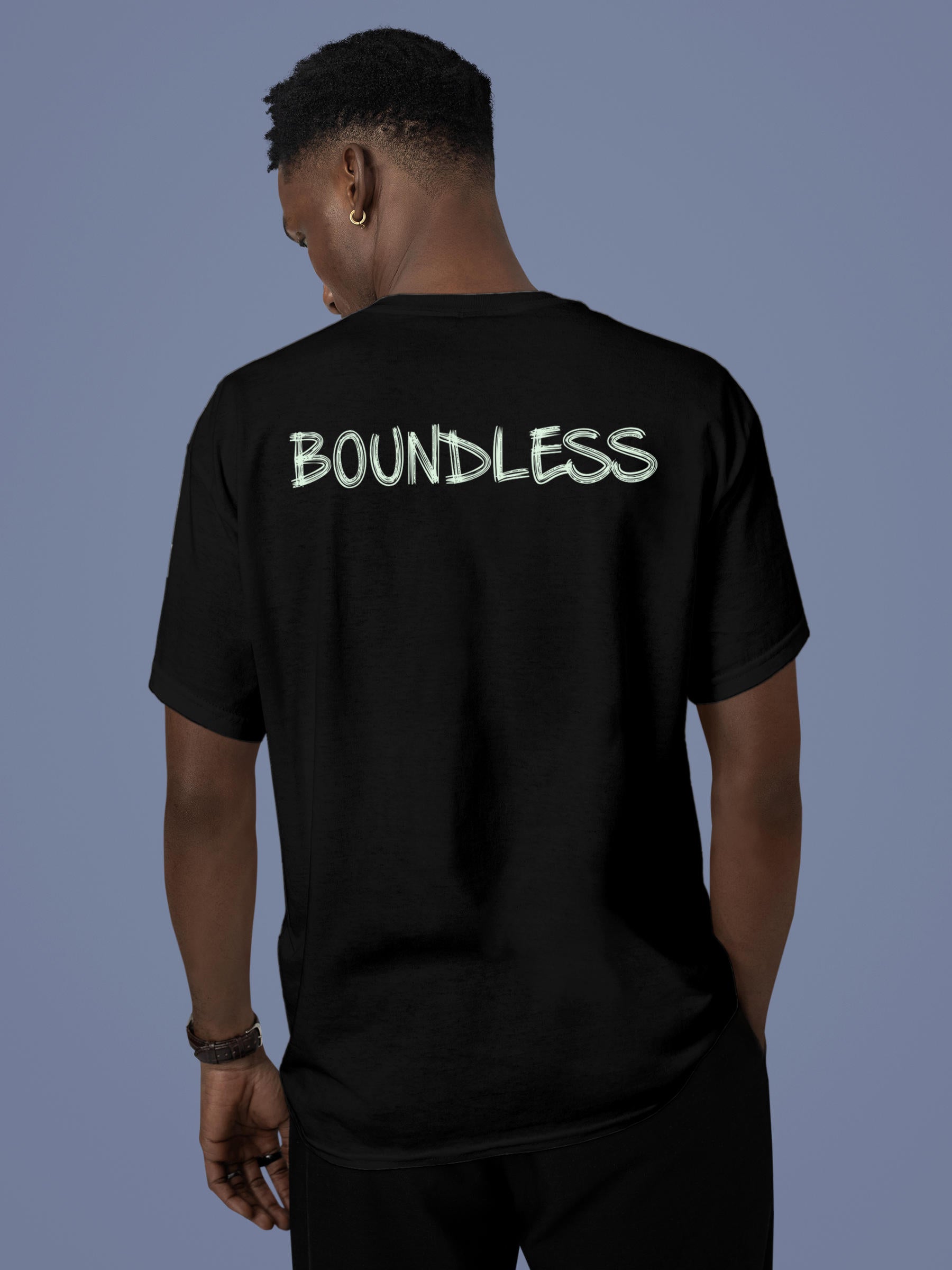 Model wearing Men's Black Round Neck T-shirt with 'Boundless' design, offering effortless style and premium comfort