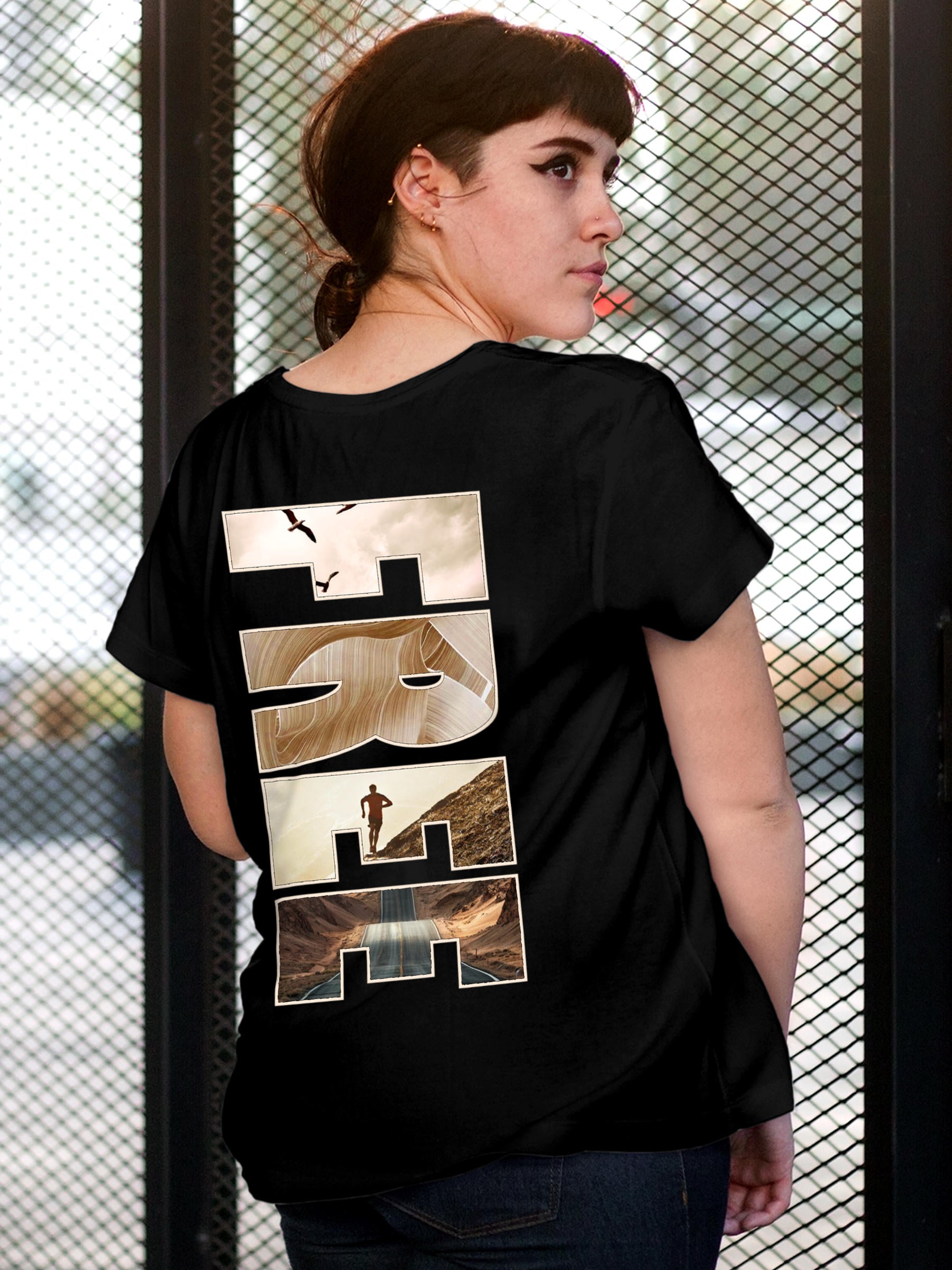 Model wearing Women's Black Round Neck T-shirt with 'Free & Boundless' design, offering effortless style and premium comfort
