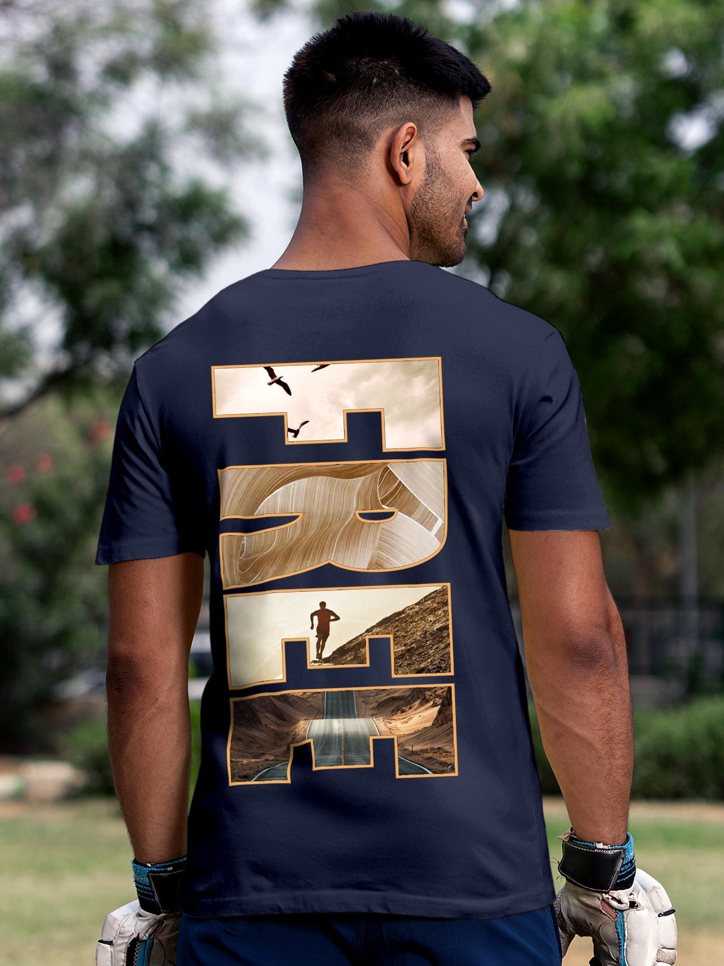 Model wearing Men's Navy Blue Round Neck T-shirt with 'Free & Boundless' design, offering effortless style and premium comfort