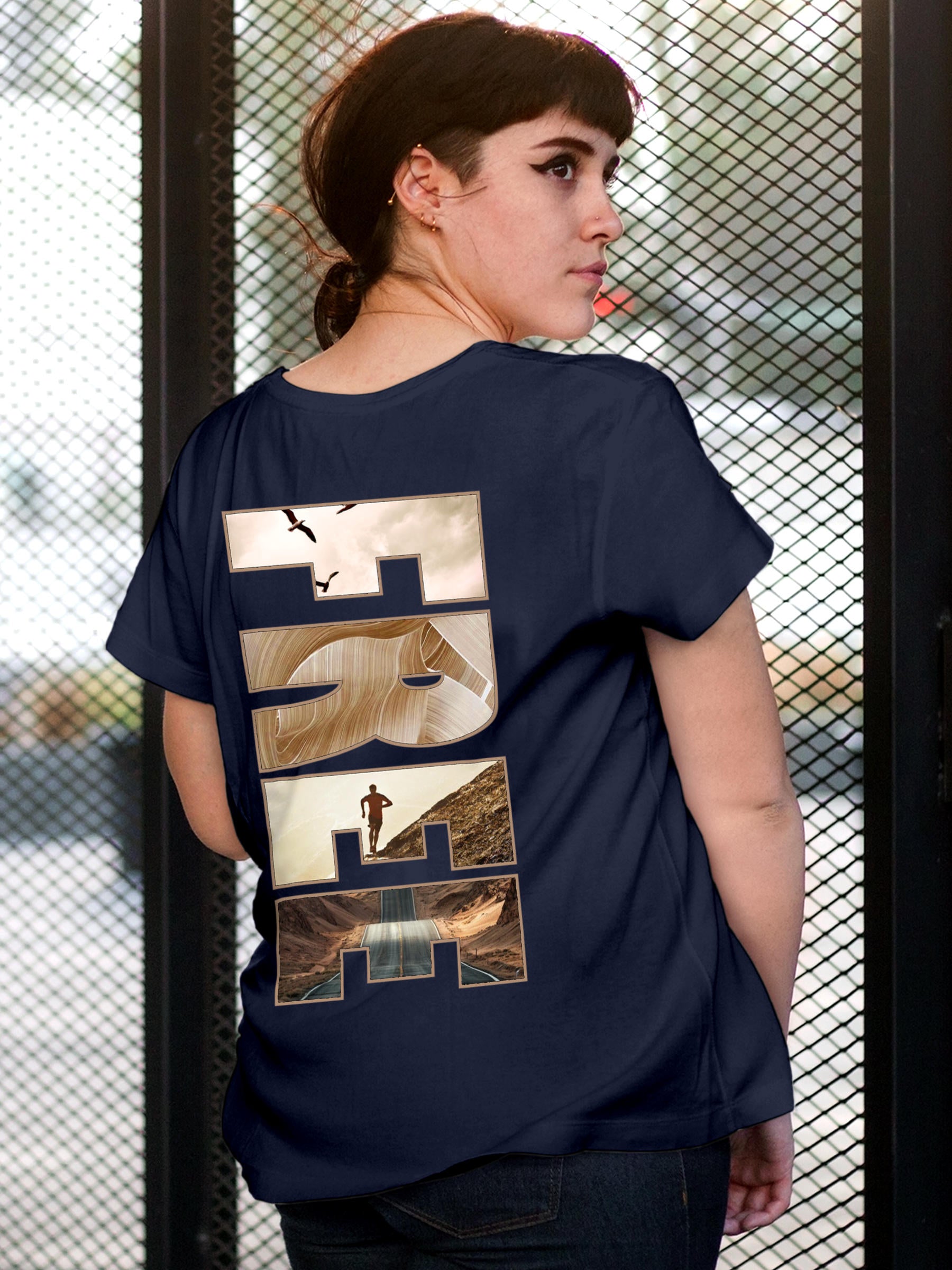Model wearing Women's Navy Blue Round Neck T-shirt with 'Free & Boundless' design, offering effortless style and premium comfort