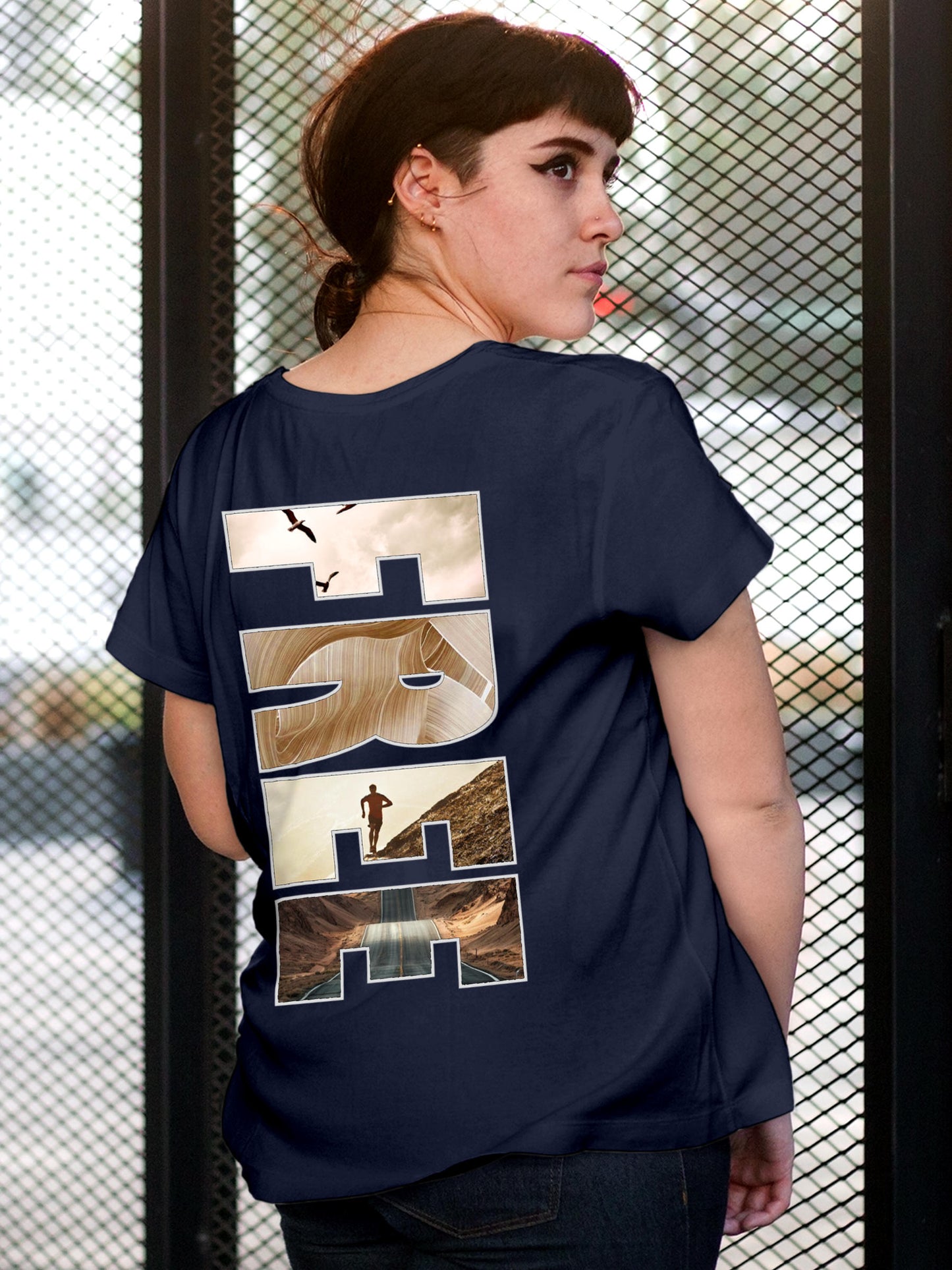 Model wearing Women's Navy Blue Round Neck T-shirt with 'Free & Boundless' design, offering effortless style and premium comfort
