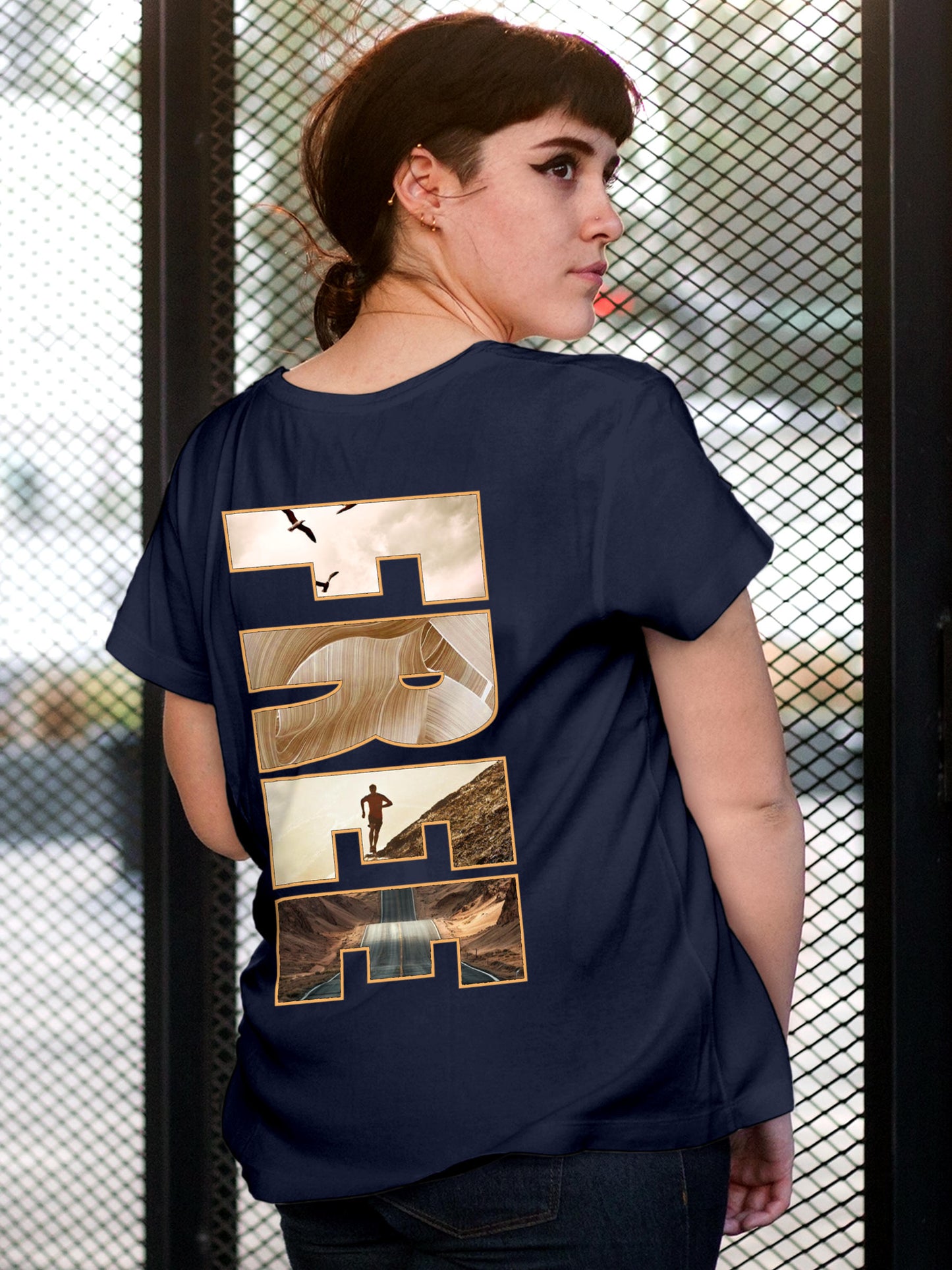 Model wearing Women's Navy Blue Round Neck T-shirt with 'Free & Boundless' design, offering effortless style and premium comfort