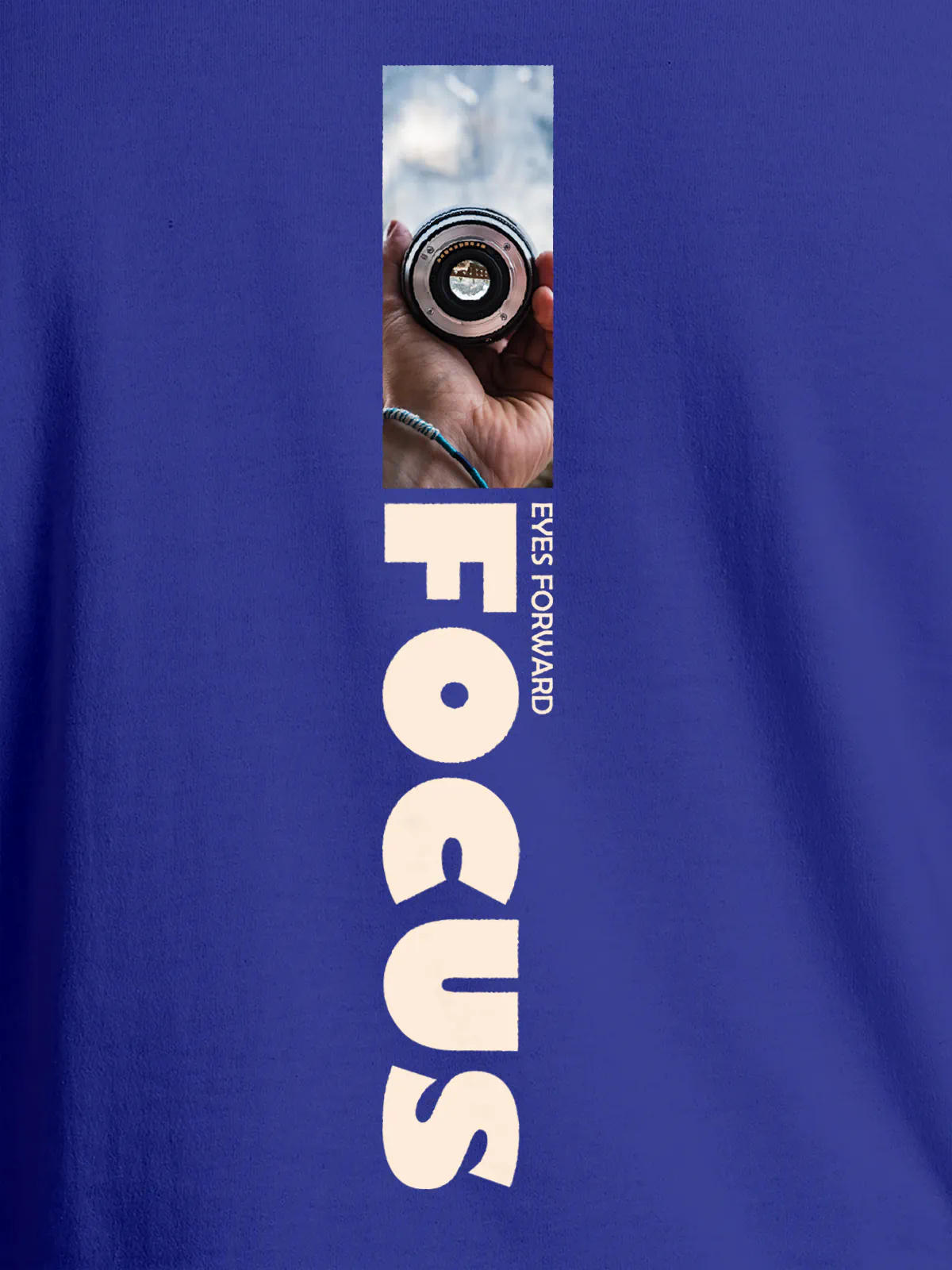 Close up of 'Focus' design on Women's Blue Round Neck T-shirt, highlighting intricate details and vibrant print.