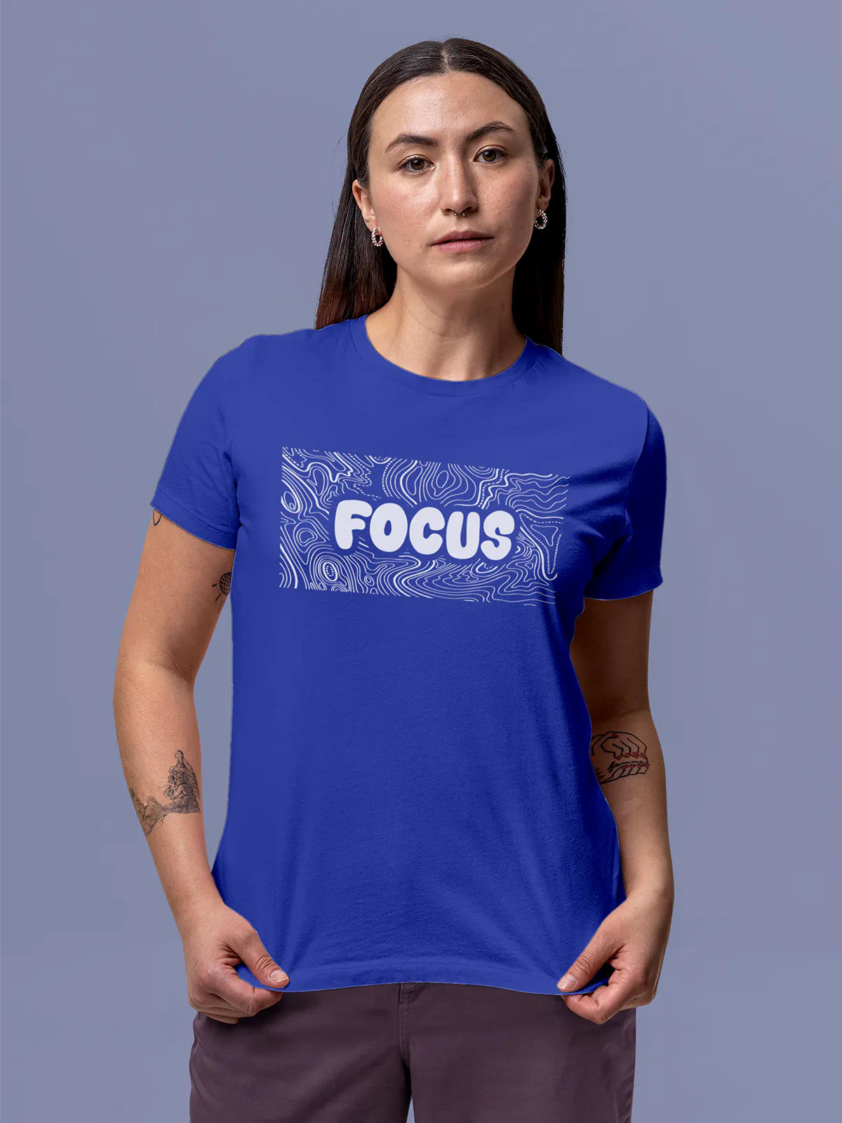 Model wearing Women's Blue Round Neck T-shirt with 'Focus In Chaos' design, offering effortless style and premium comfort