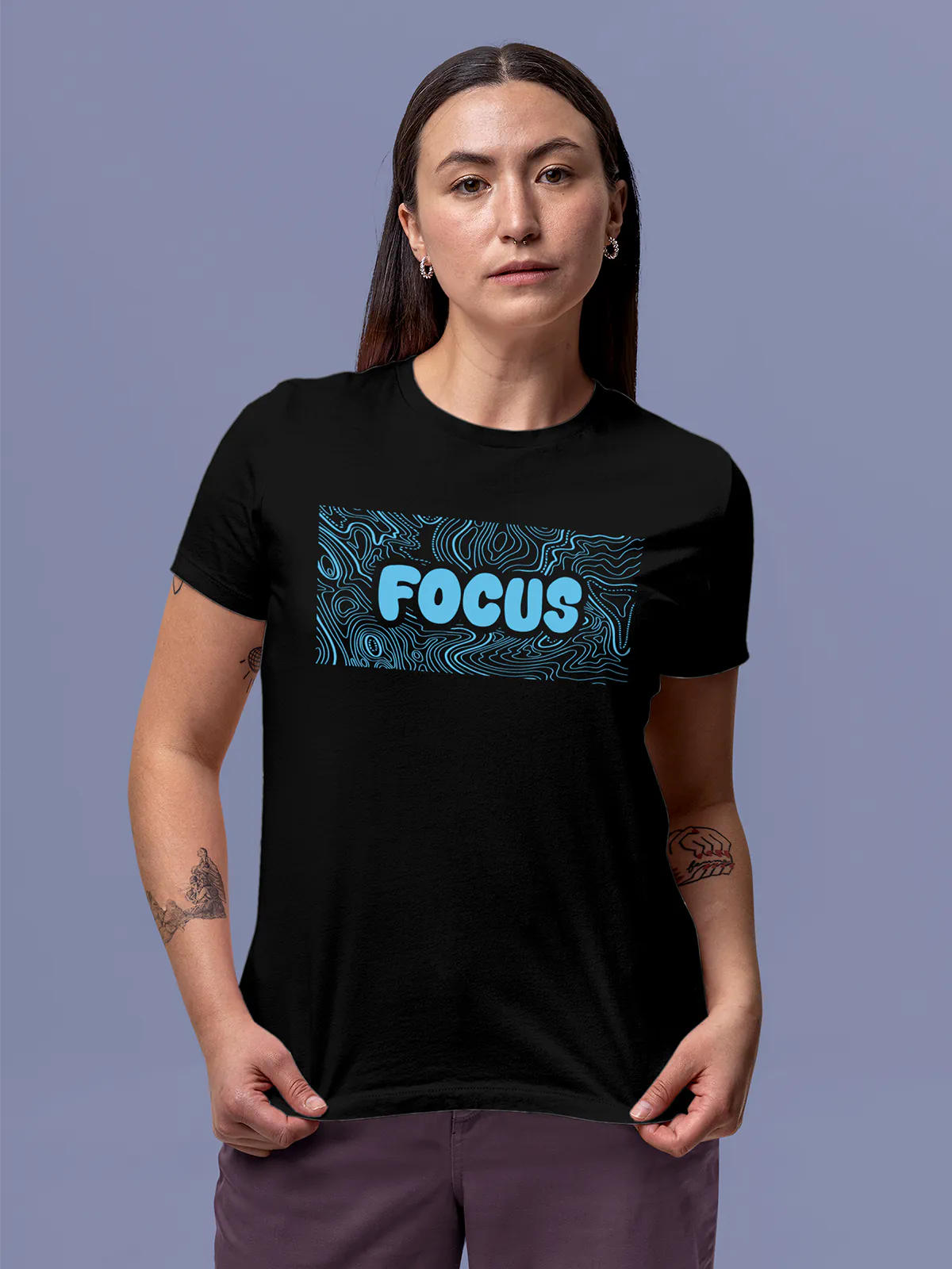Model wearing Women's Black Round Neck T-shirt with 'Focus In Chaos' design, offering effortless style and premium comfort