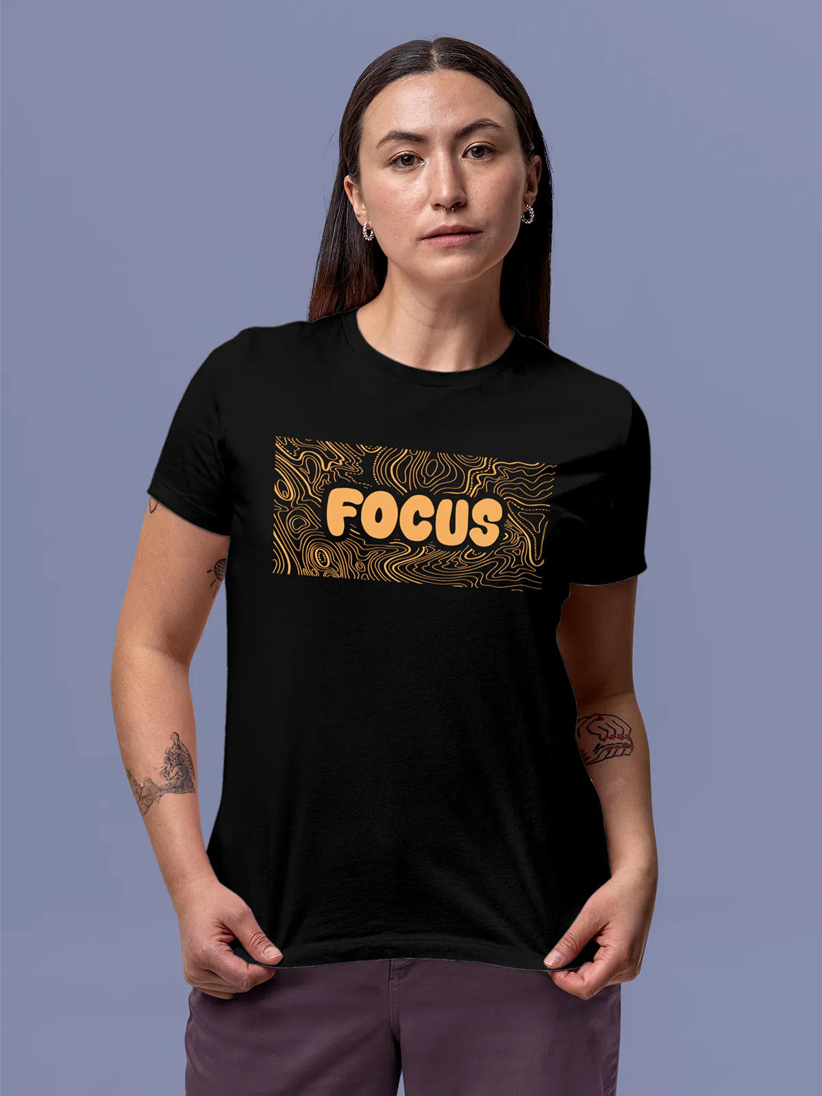 Model wearing Women's Black Round Neck T-shirt with 'Focus In Chaos' design, offering effortless style and premium comfort