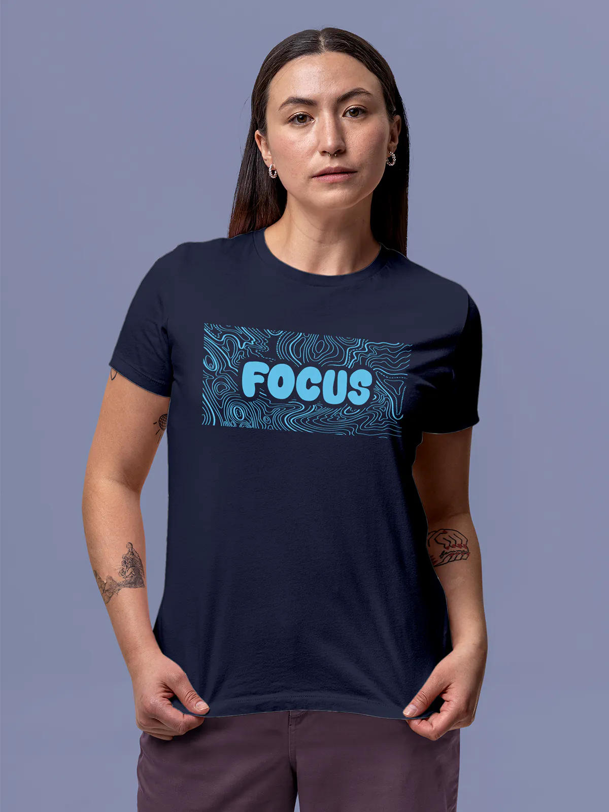 Model wearing Women's Navy Blue Round Neck T-shirt with 'Focus In Chaos' design, offering effortless style and premium comfort