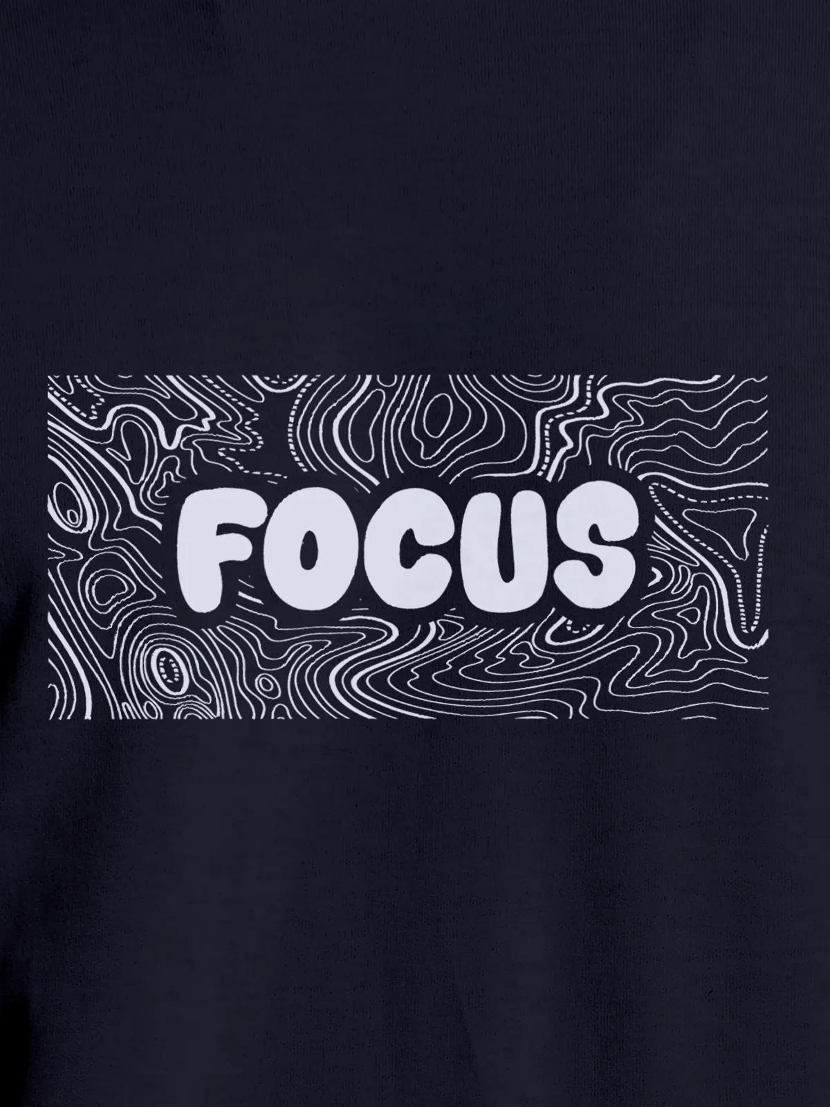 Close up of 'Focus In Chaos' design on Women's Navy Blue Round Neck T-shirt, highlighting intricate details and vibrant print.