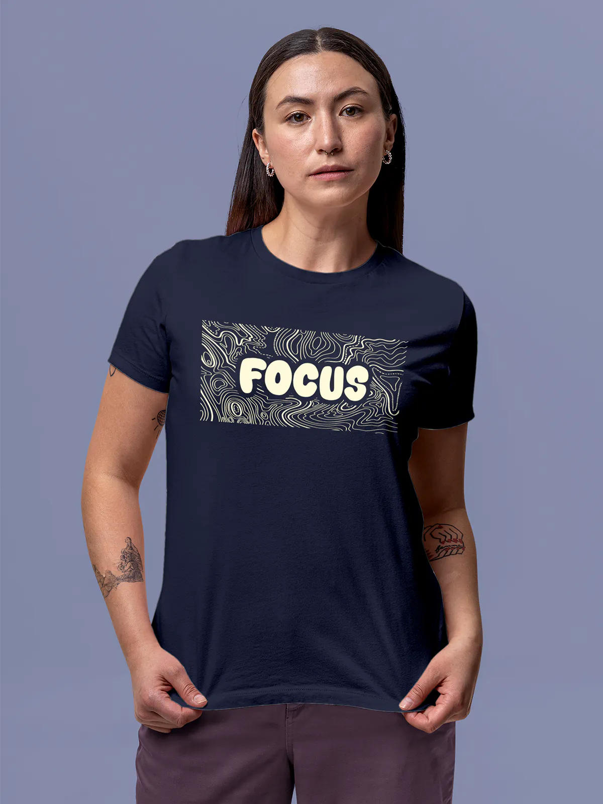 Model wearing Women's Navy Blue Round Neck T-shirt with 'Focus In Chaos' design, offering effortless style and premium comfort