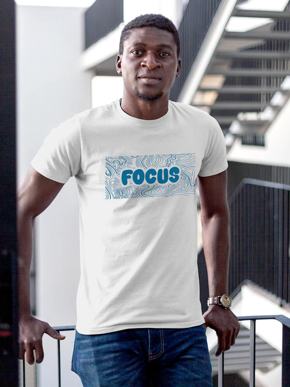 Model wearing Men's White Round Neck T-shirt with 'Focus In Chaos' design, offering effortless style and premium comfort