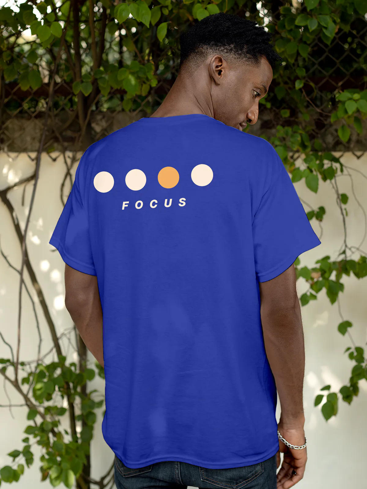 Model wearing Men's Blue Round Neck T-shirt with 'Focus On Goal' design, offering effortless style and premium comfort
