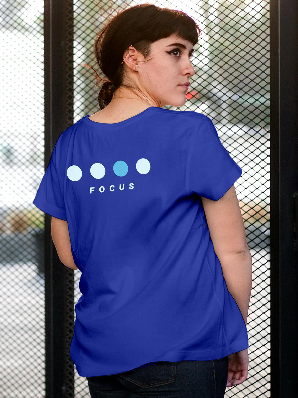 Model wearing Women's Blue Round Neck T-shirt with 'Focus On Goal' design, offering effortless style and premium comfort