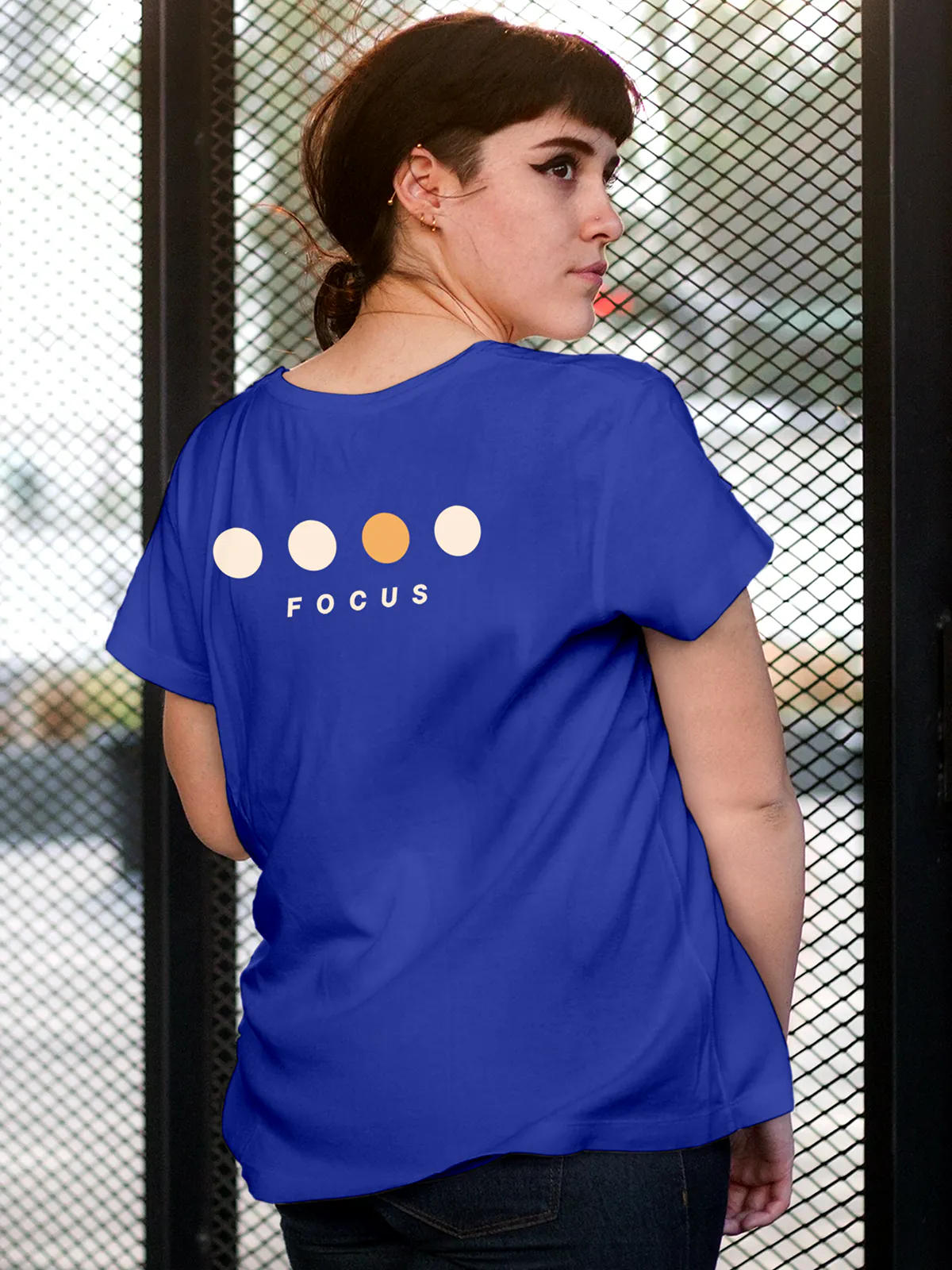 Model wearing Women's Blue Round Neck T-shirt with 'Focus On Goal' design, offering effortless style and premium comfort