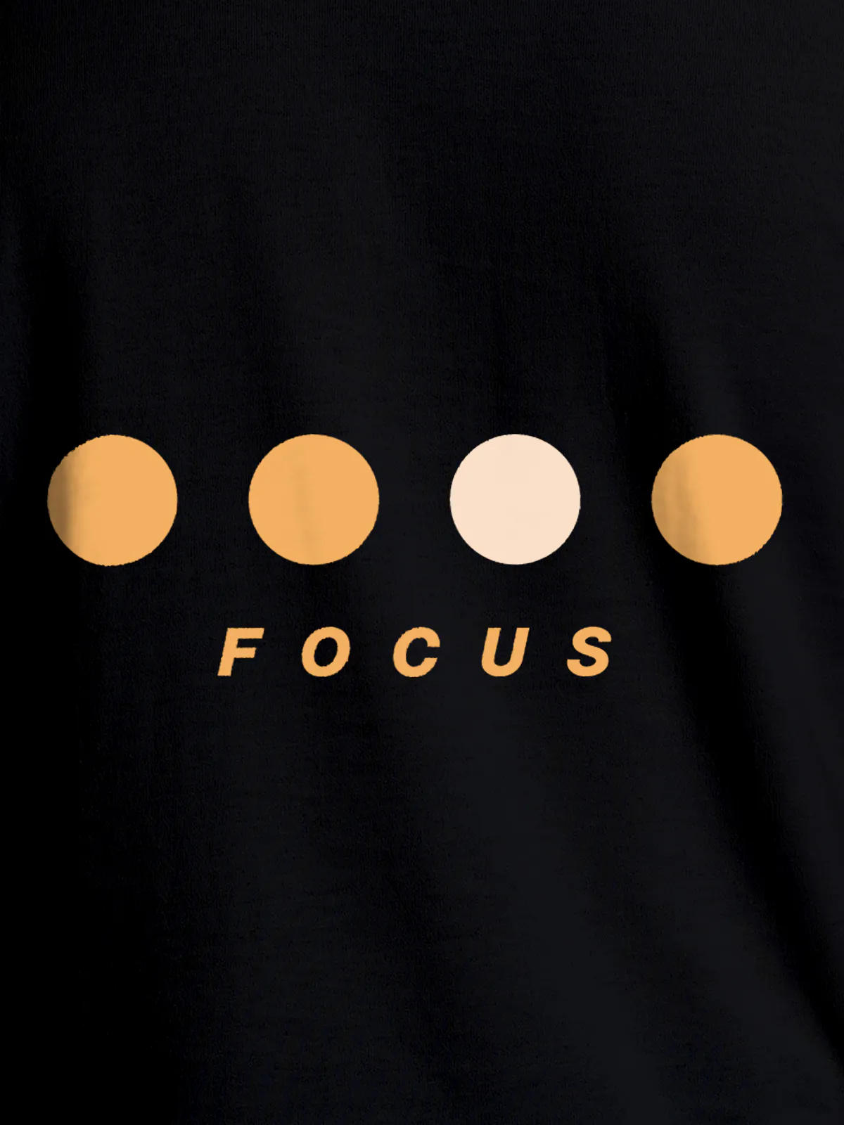 Close up of 'Focus On Goal' design on Women's Black Round Neck T-shirt, highlighting intricate details and vibrant print.