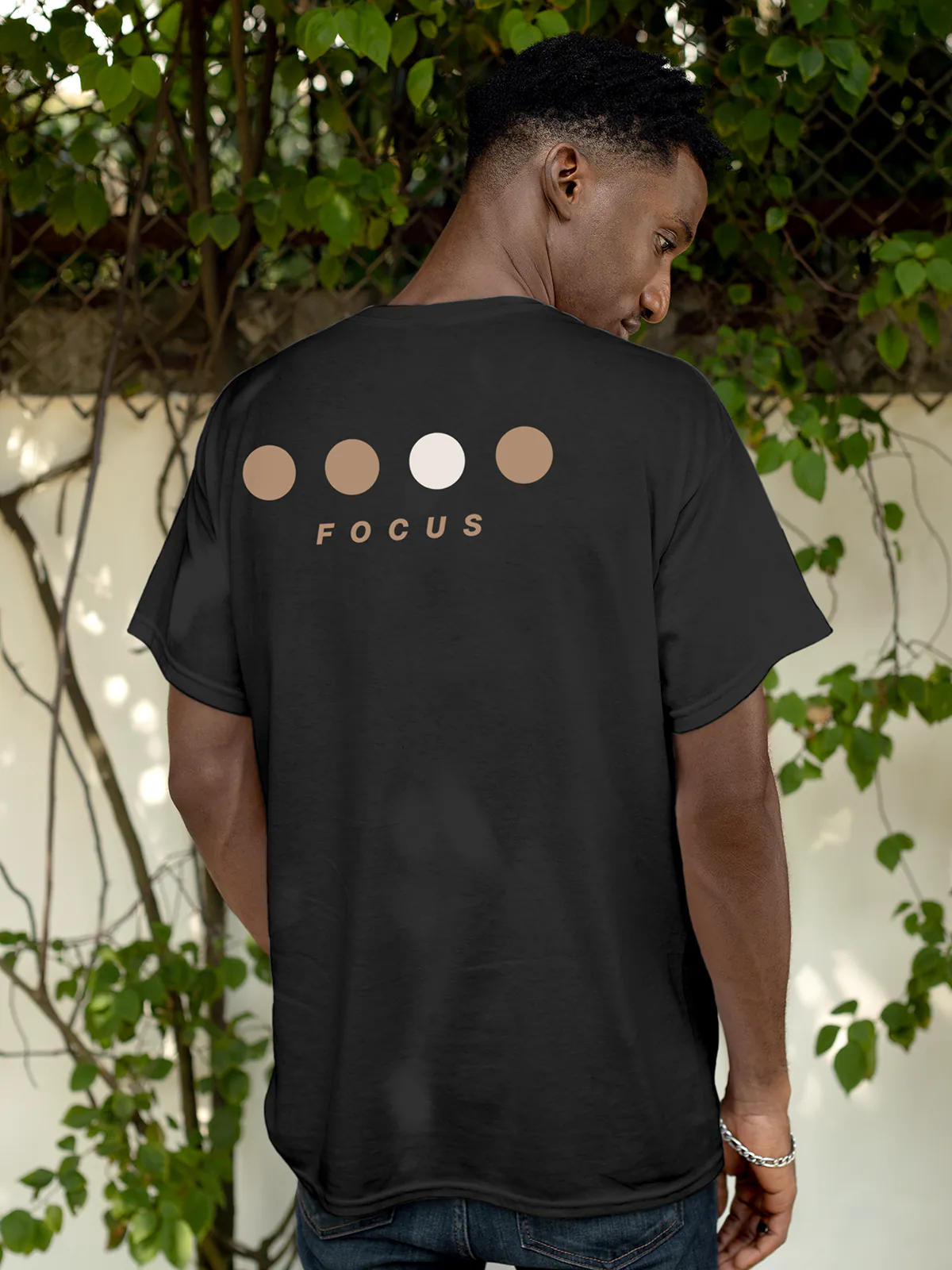 Model wearing Men's Dark Grey Round Neck T-shirt with 'Focus On Goal' design, offering effortless style and premium comfort