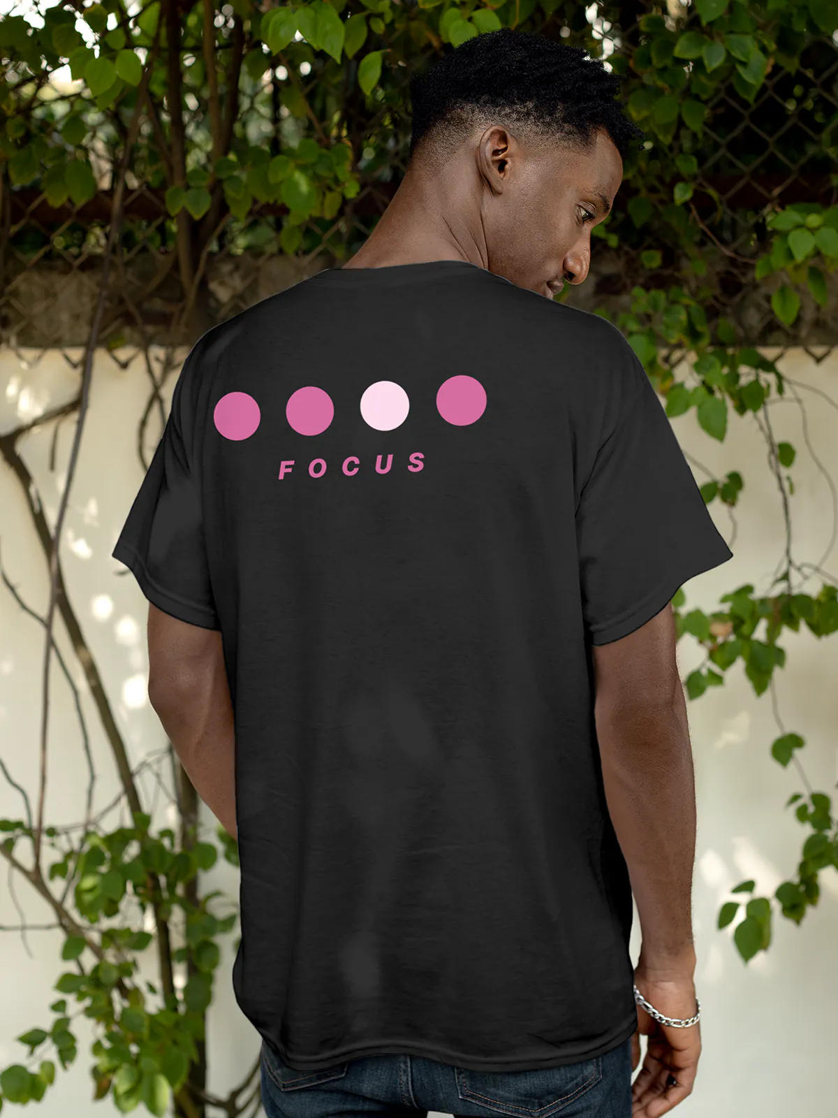 Model wearing Men's Dark Grey Round Neck T-shirt with 'Focus On Goal' design, offering effortless style and premium comfort