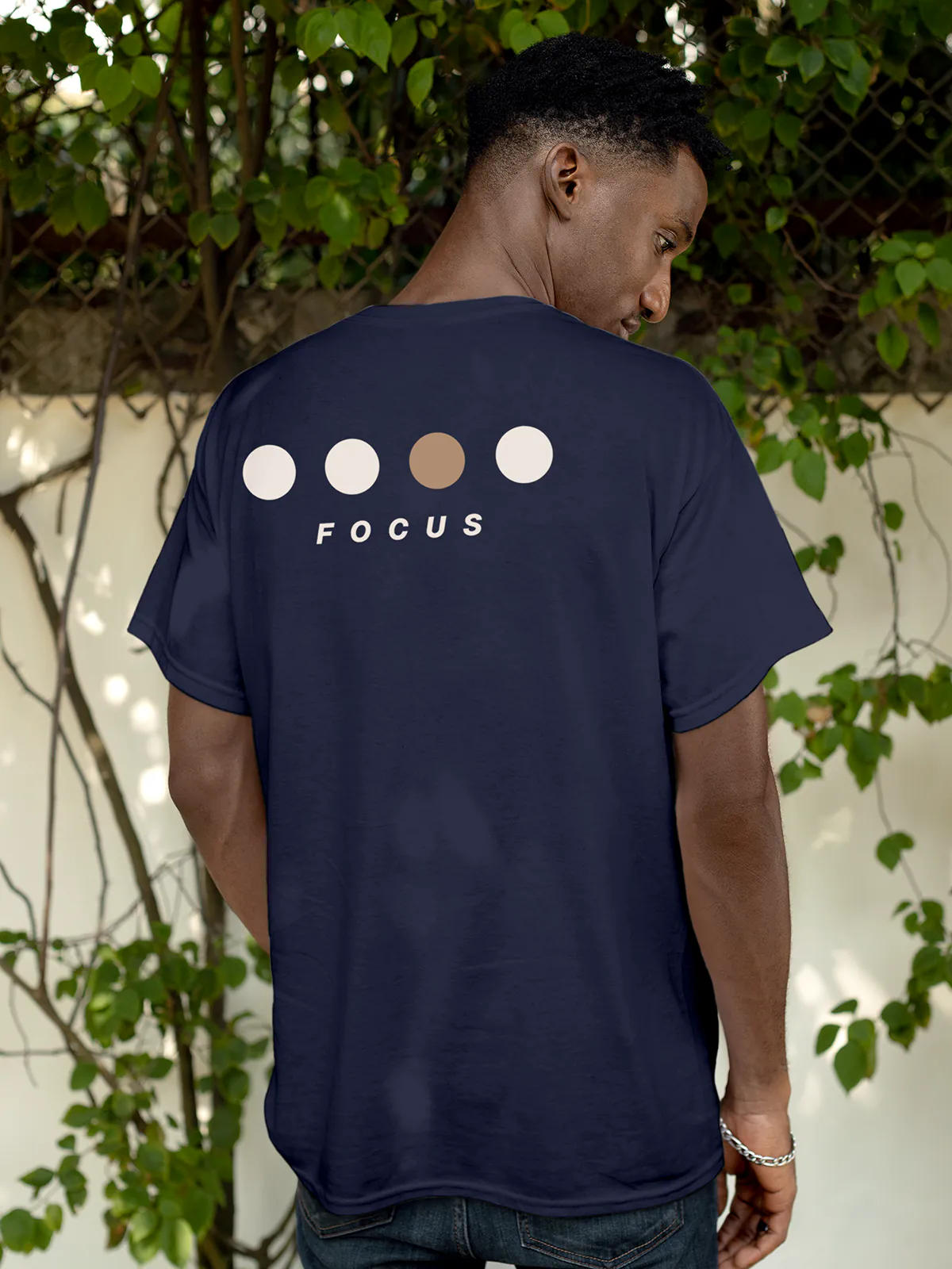 Model wearing Men's Navy Blue Round Neck T-shirt with 'Focus On Goal' design, offering effortless style and premium comfort