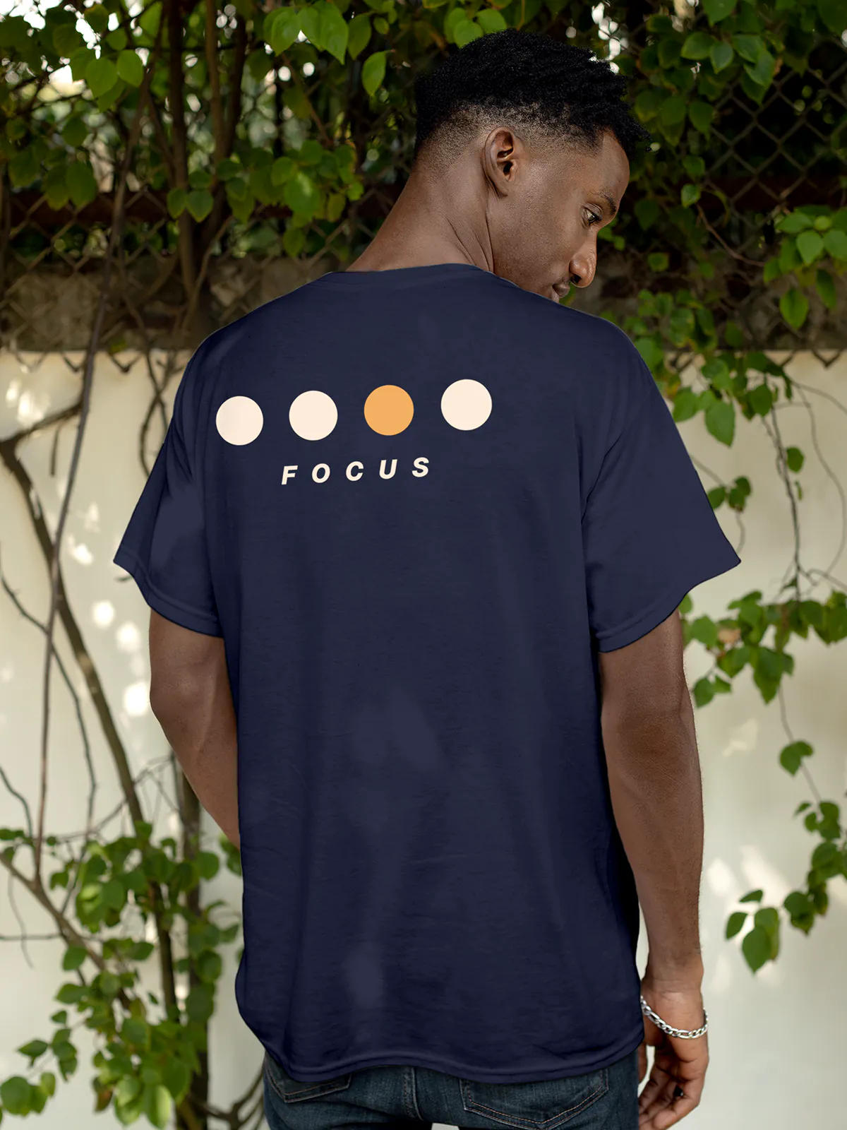 Model wearing Men's Navy Blue Round Neck T-shirt with 'Focus On Goal' design, offering effortless style and premium comfort