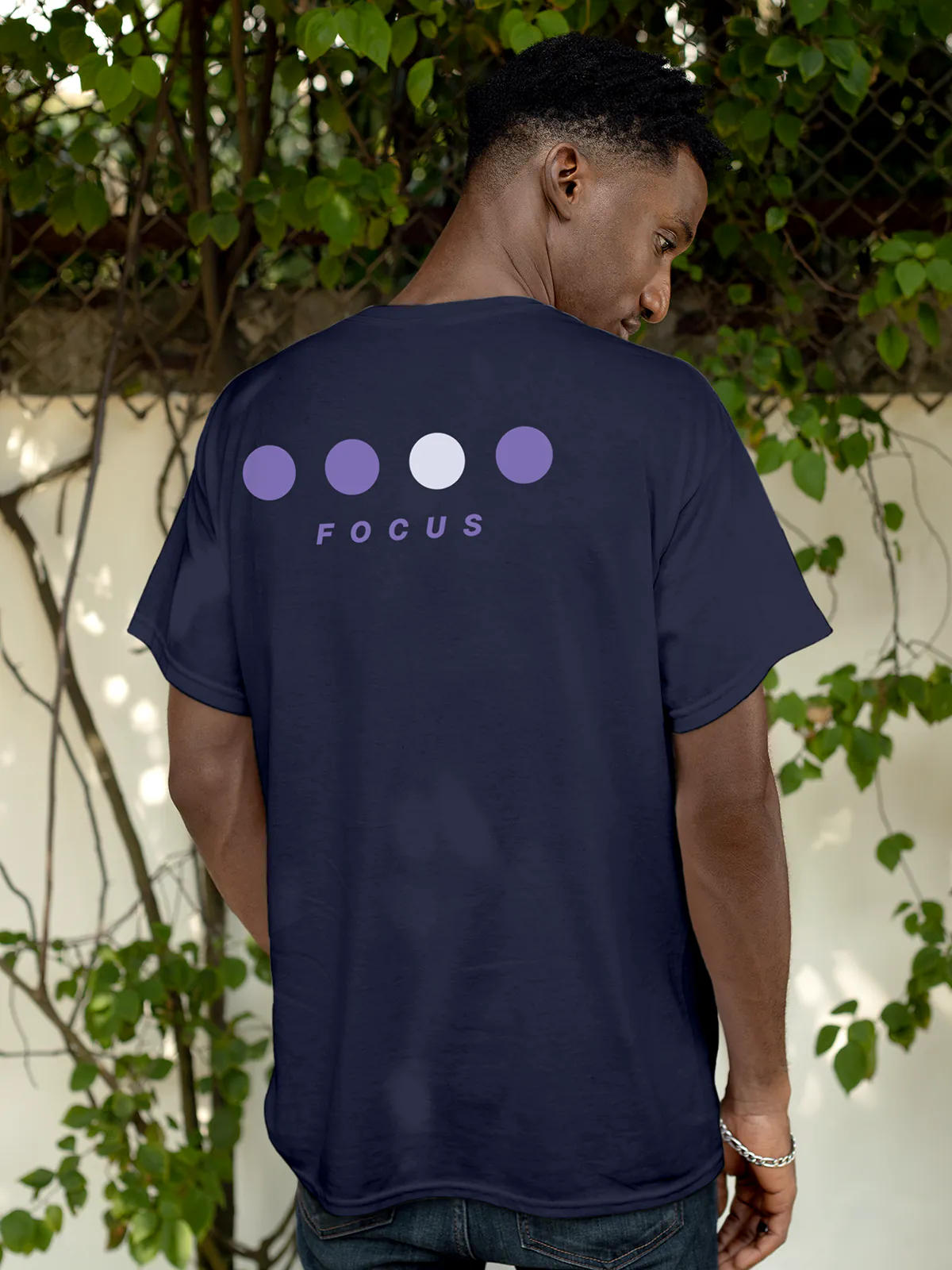 Model wearing Men's Navy Blue Round Neck T-shirt with 'Focus On Goal' design, offering effortless style and premium comfort