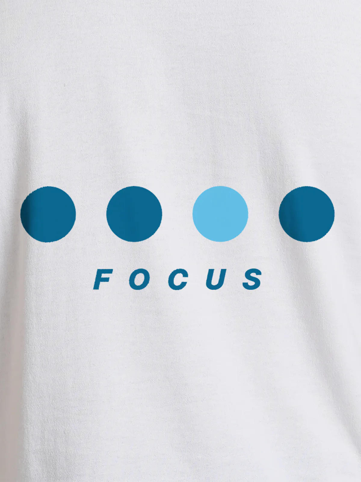 Close up of 'Focus On Goal' design on Women's White Round Neck T-shirt, highlighting intricate details and vibrant print.