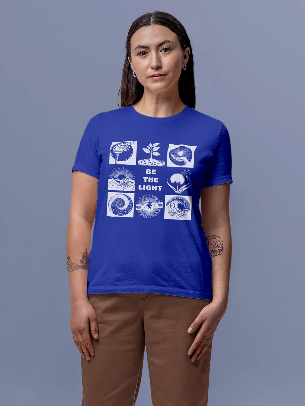 Model wearing Women's Blue Round Neck T-shirt with 'Be The Light' design, offering effortless style and premium comfort
