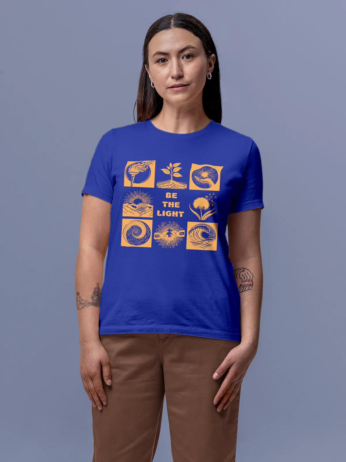 Model wearing Women's Blue Round Neck T-shirt with 'Be The Light' design, offering effortless style and premium comfort