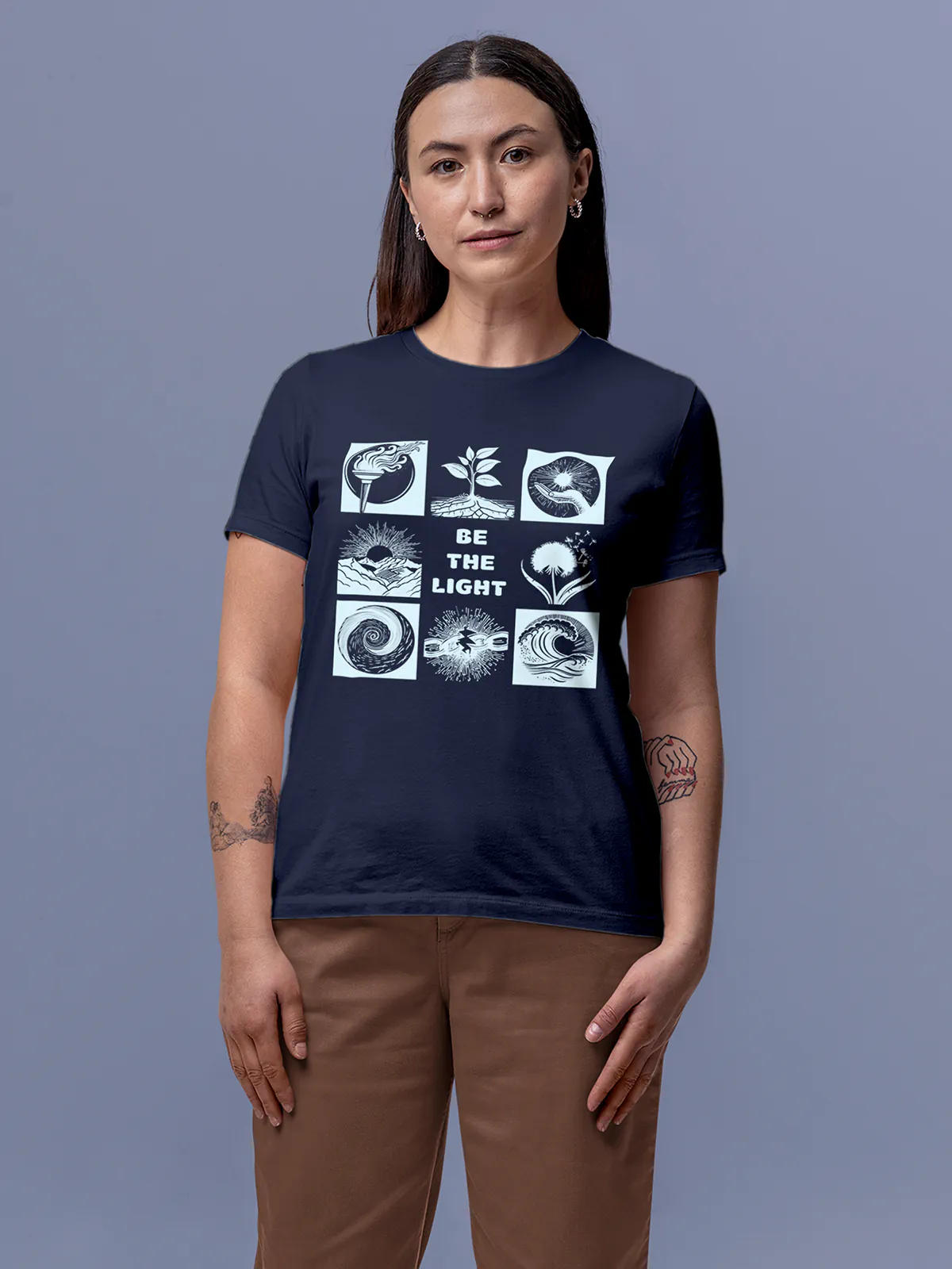 Model wearing Women's Navy Blue Round Neck T-shirt with 'Be The Light' design, offering effortless style and premium comfort