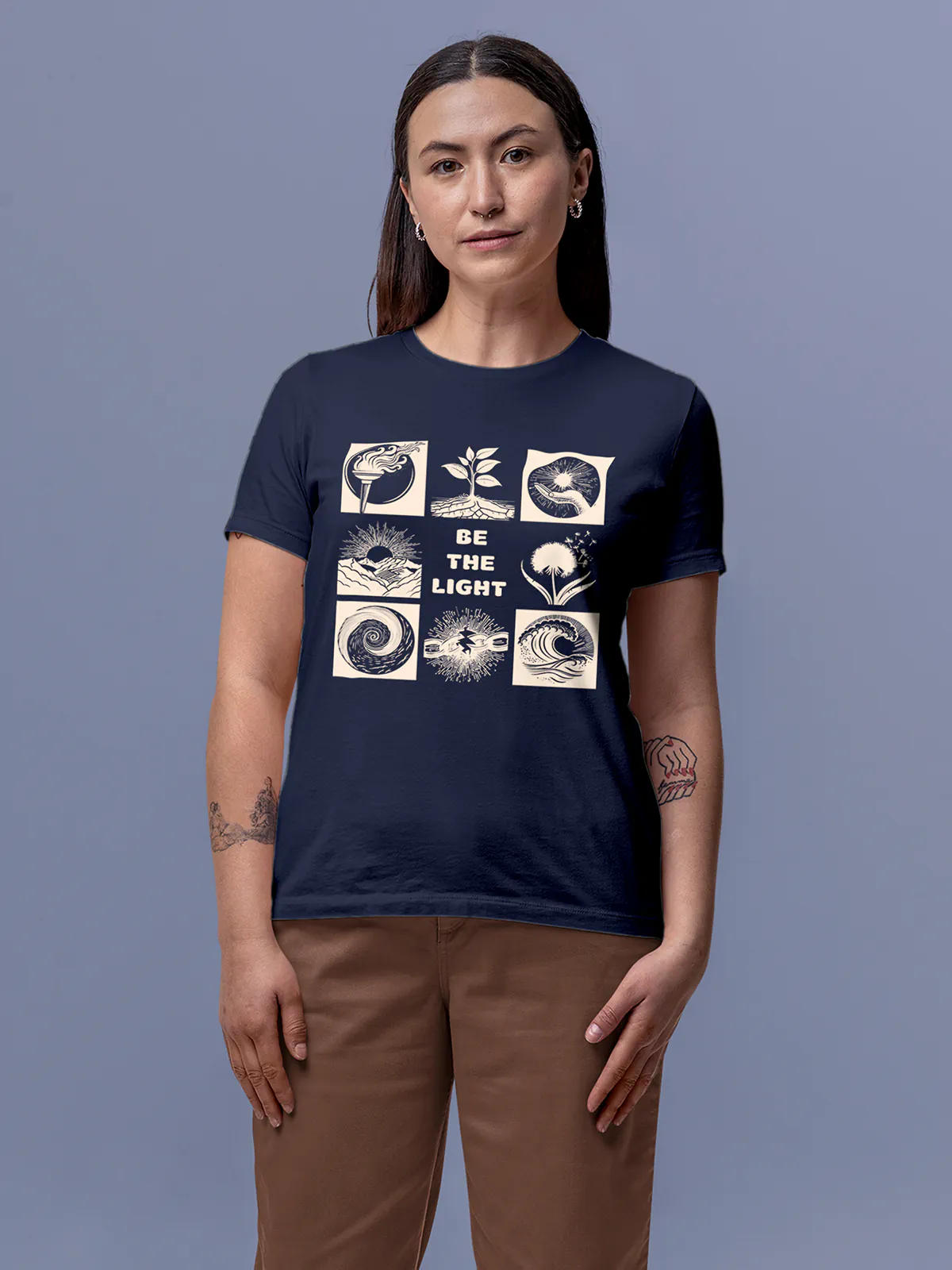 Model wearing Women's Navy Blue Round Neck T-shirt with 'Be The Light' design, offering effortless style and premium comfort