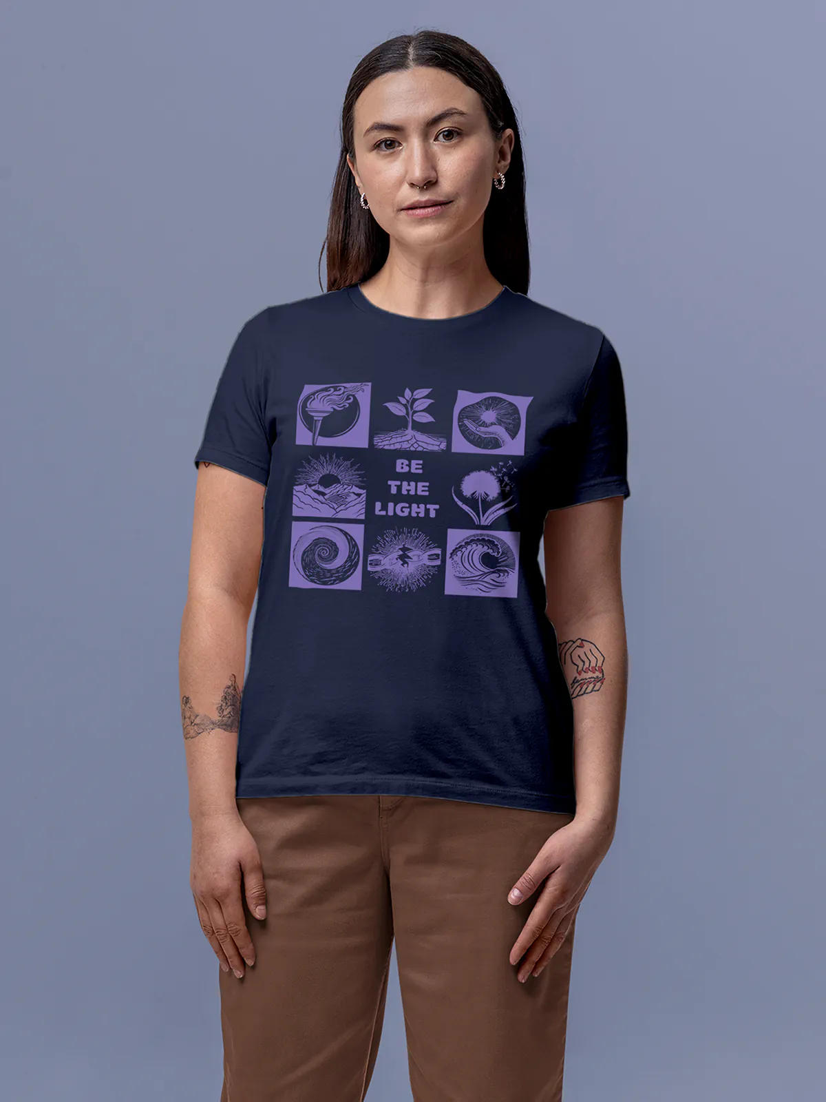 Model wearing Women's Navy Blue Round Neck T-shirt with 'Be The Light' design, offering effortless style and premium comfort