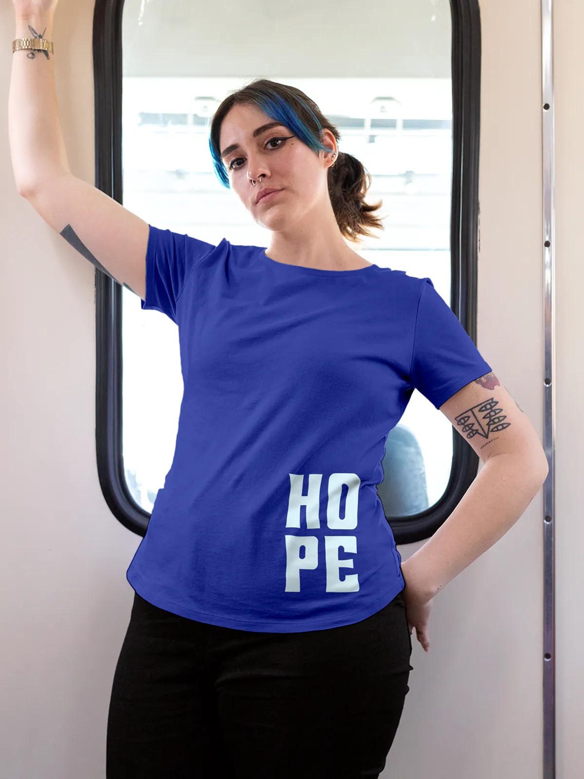 Model wearing Women's Blue Round Neck T-shirt with 'Hope' design, offering effortless style and premium comfort