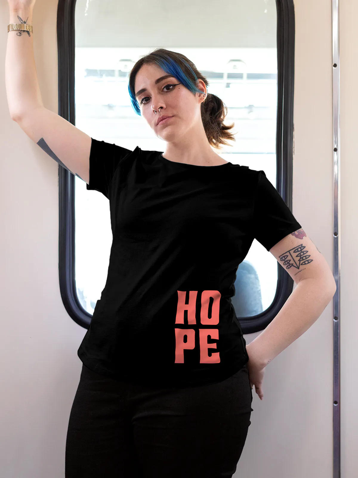 Model wearing Women's Black Round Neck T-shirt with 'Hope' design, offering effortless style and premium comfort
