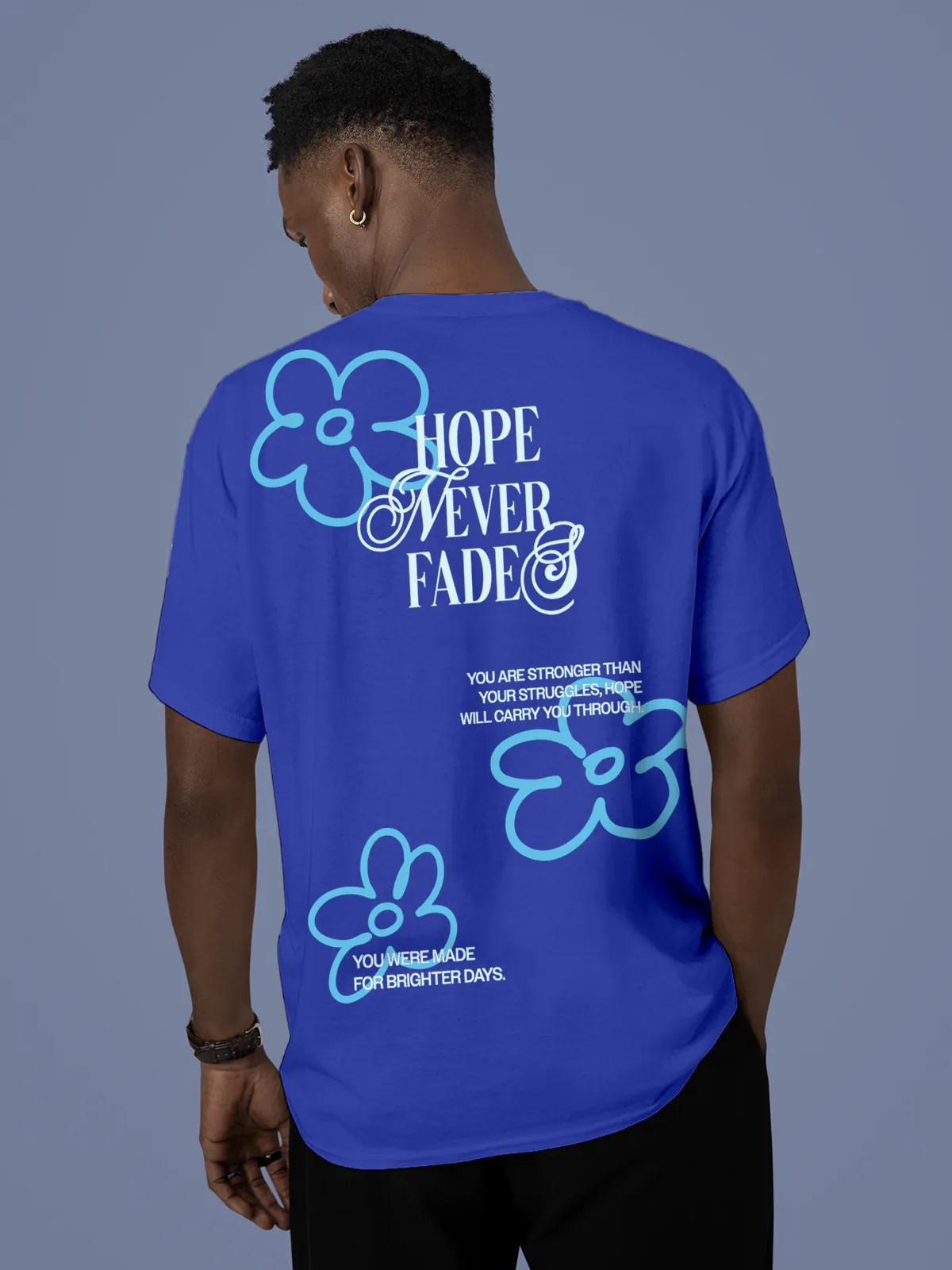 Model wearing Men's Blue Round Neck T-shirt with 'Hope Never Fades' design, offering effortless style and premium comfort
