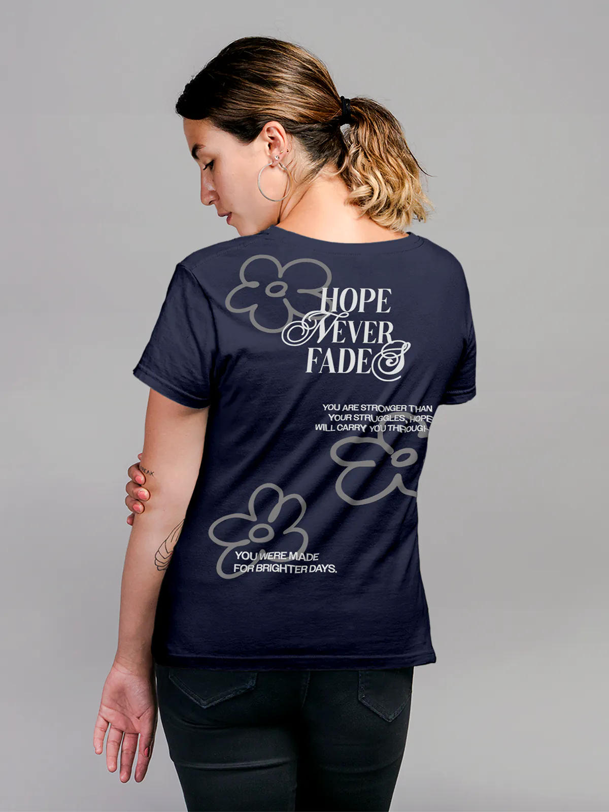 Model wearing Women's Navy Blue Round Neck T-shirt with 'Hope Never Fades' design, offering effortless style and premium comfort