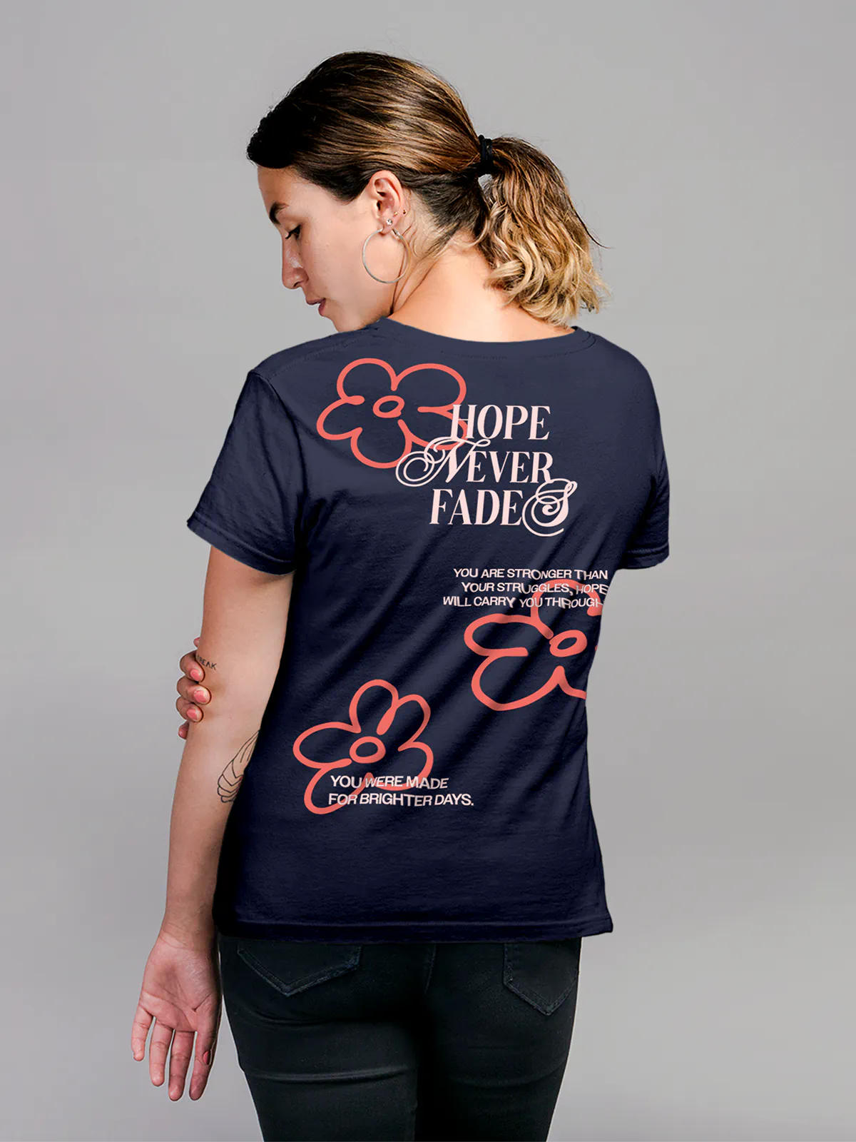 Model wearing Women's Navy Blue Round Neck T-shirt with 'Hope Never Fades' design, offering effortless style and premium comfort