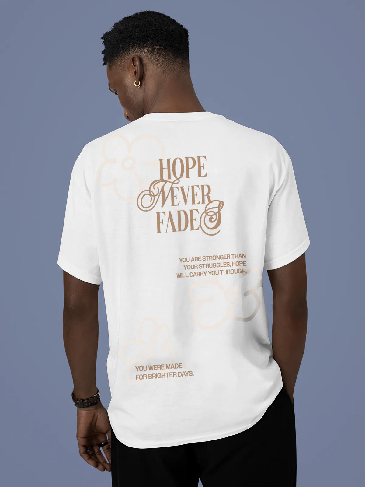 Model wearing Men's White Round Neck T-shirt with 'Hope Never Fades' design, offering effortless style and premium comfort