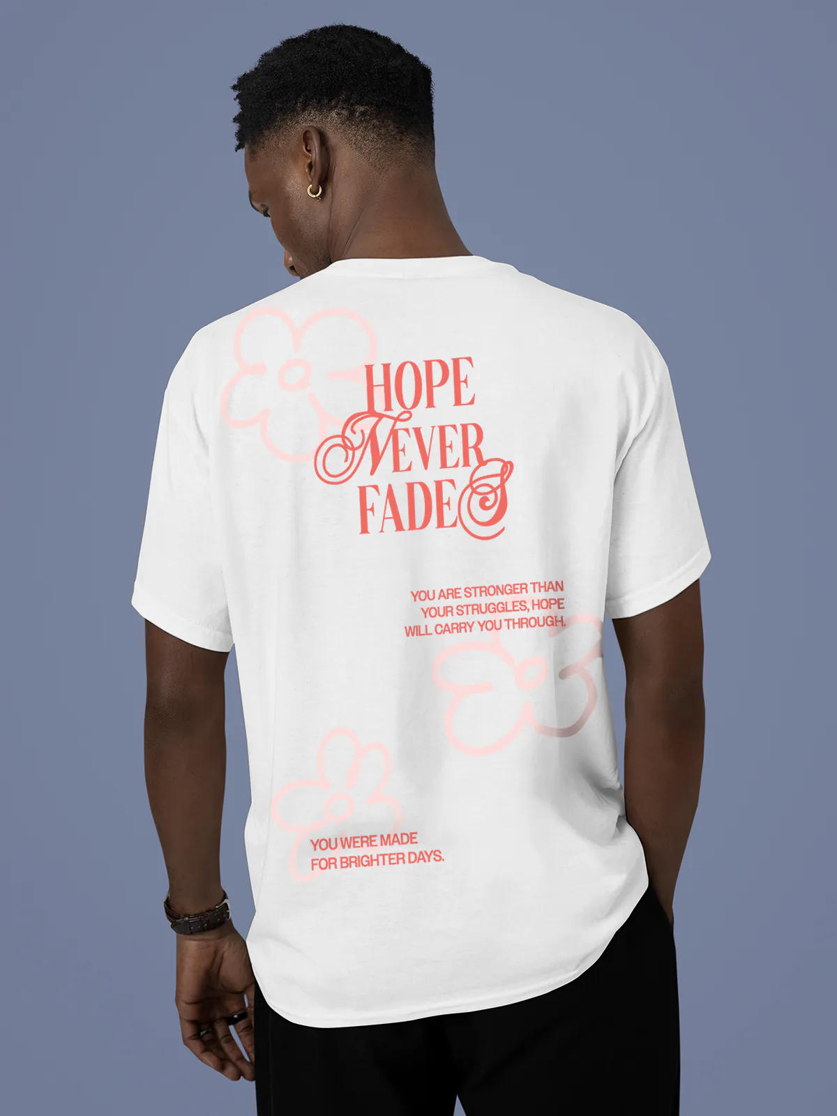 Model wearing Men's White Round Neck T-shirt with 'Hope Never Fades' design, offering effortless style and premium comfort