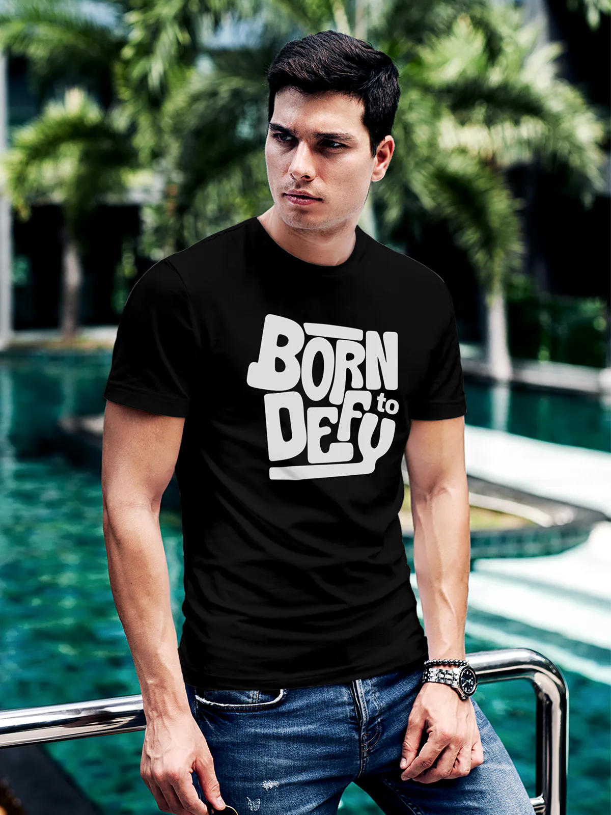 Model wearing Men's Black Round Neck T-shirt with 'Born To Defy' design, offering effortless style and premium comfort