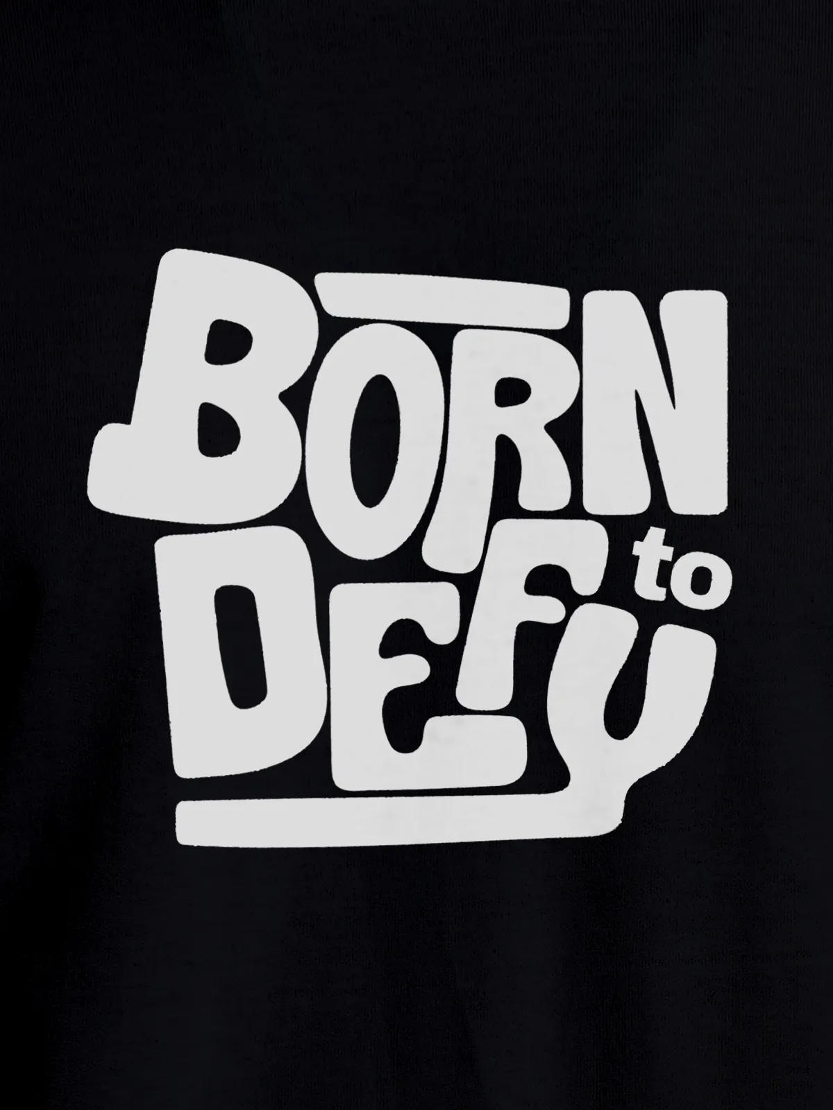 Close up of 'Born To Defy' design on Men's Black Round Neck T-shirt, highlighting intricate details and vibrant print.