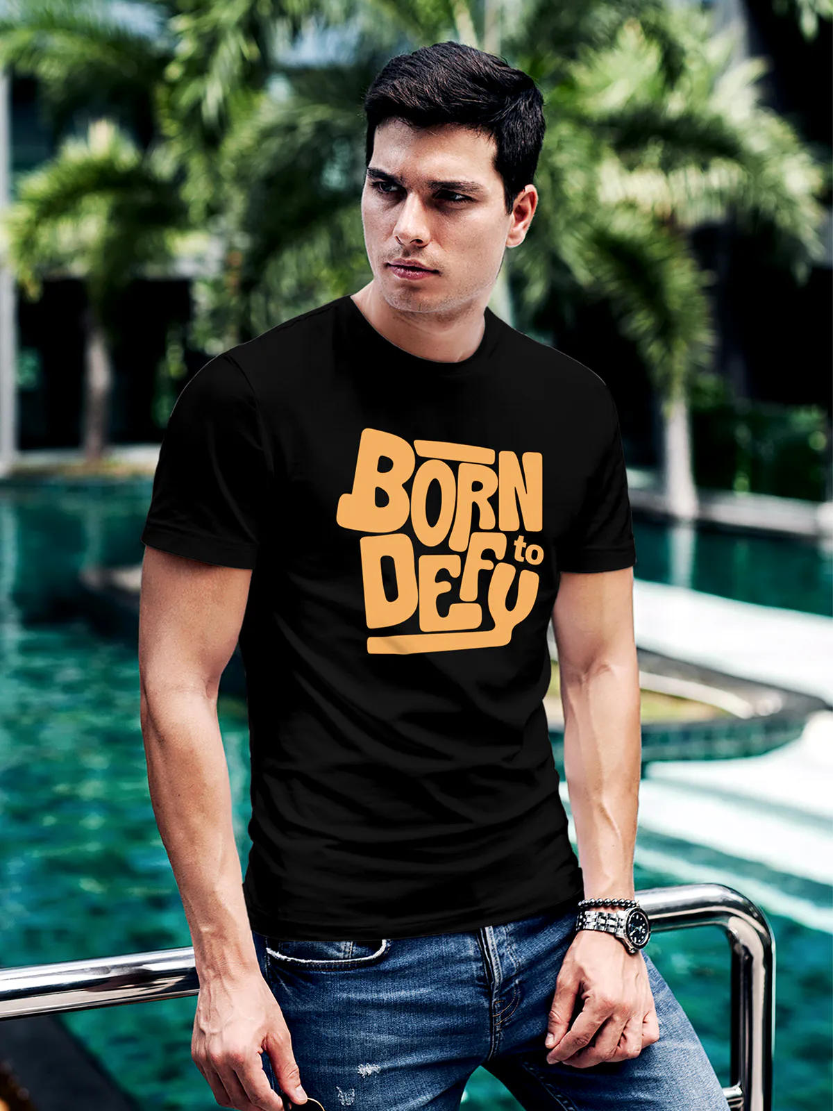 Model wearing Men's Black Round Neck T-shirt with 'Born To Defy' design, offering effortless style and premium comfort