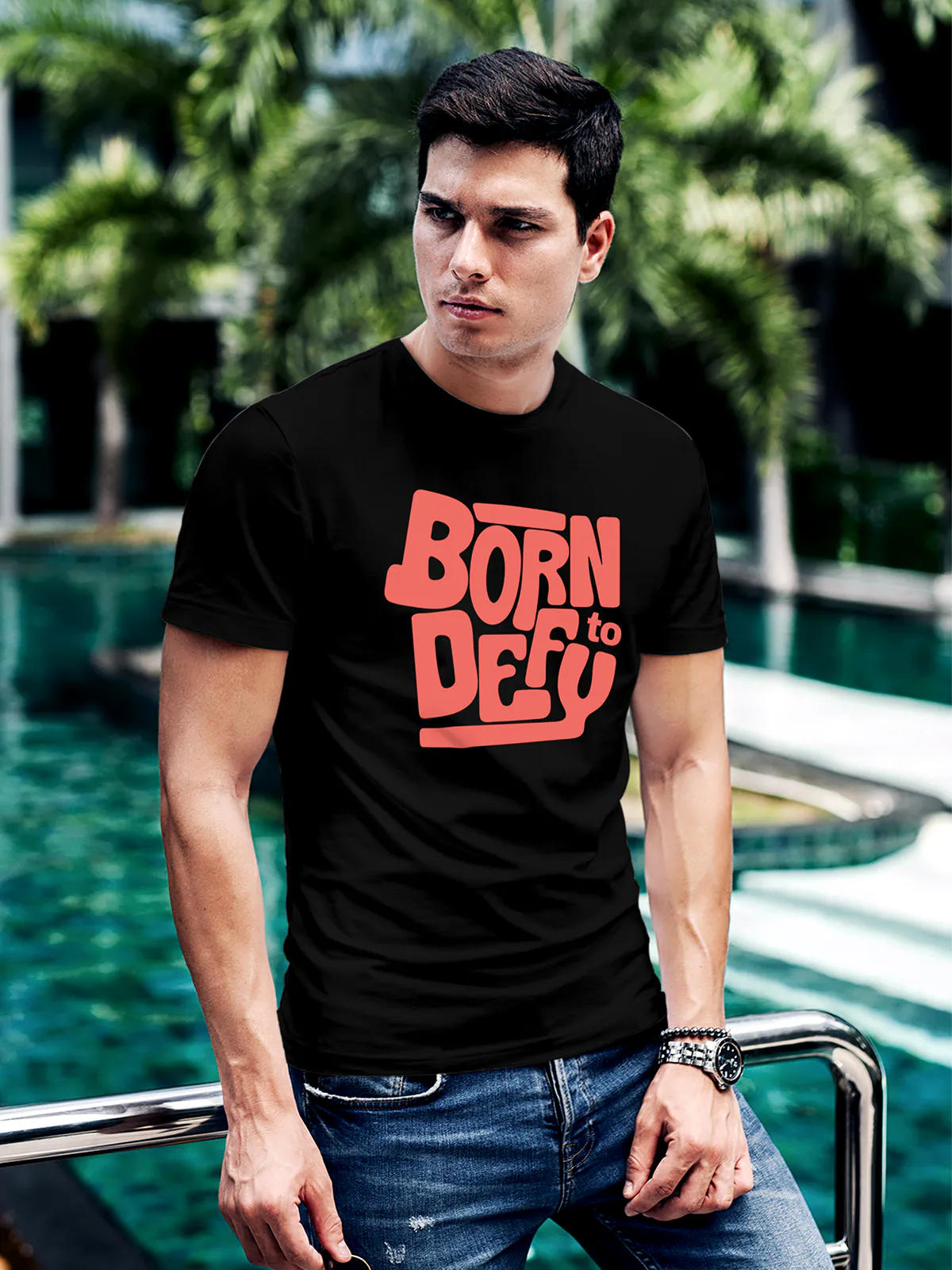 Model wearing Men's Black Round Neck T-shirt with 'Born To Defy' design, offering effortless style and premium comfort