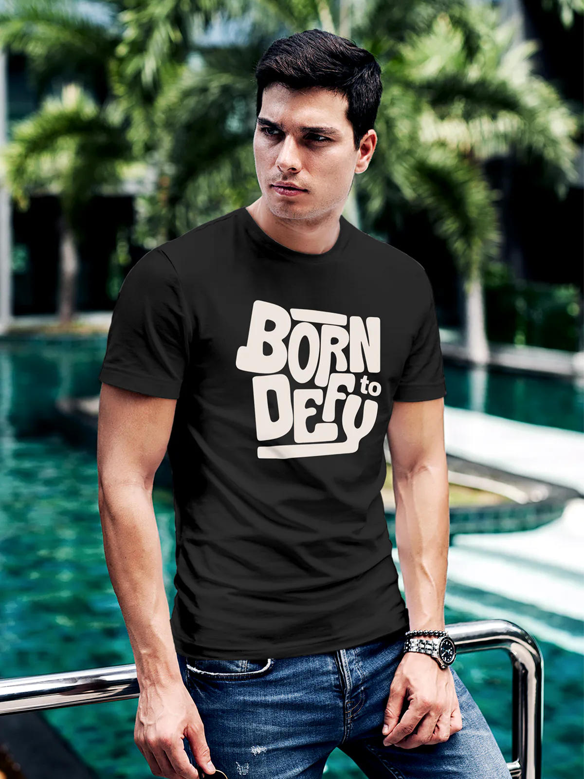 Model wearing Men's Dark Grey Round Neck T-shirt with 'Born To Defy' design, offering effortless style and premium comfort