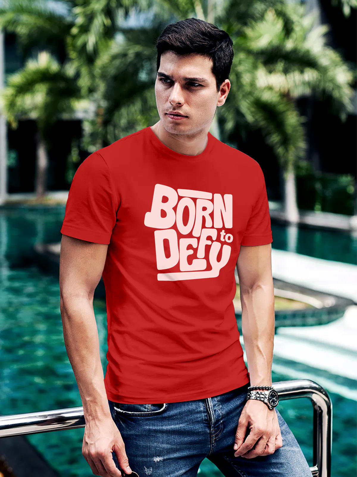 Model wearing Men's Red Round Neck T-shirt with 'Born To Defy' design, offering effortless style and premium comfort