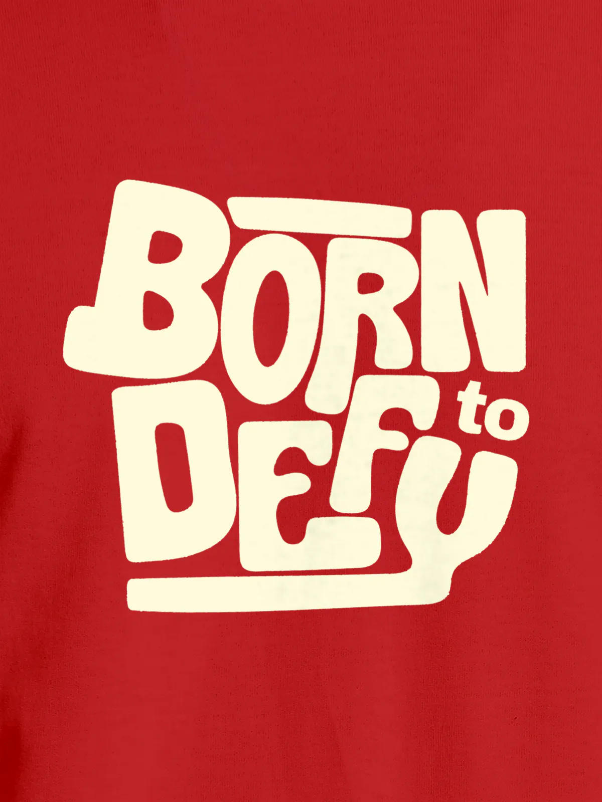 Close up of 'Born To Defy' design on Men's Red Round Neck T-shirt, highlighting intricate details and vibrant print.