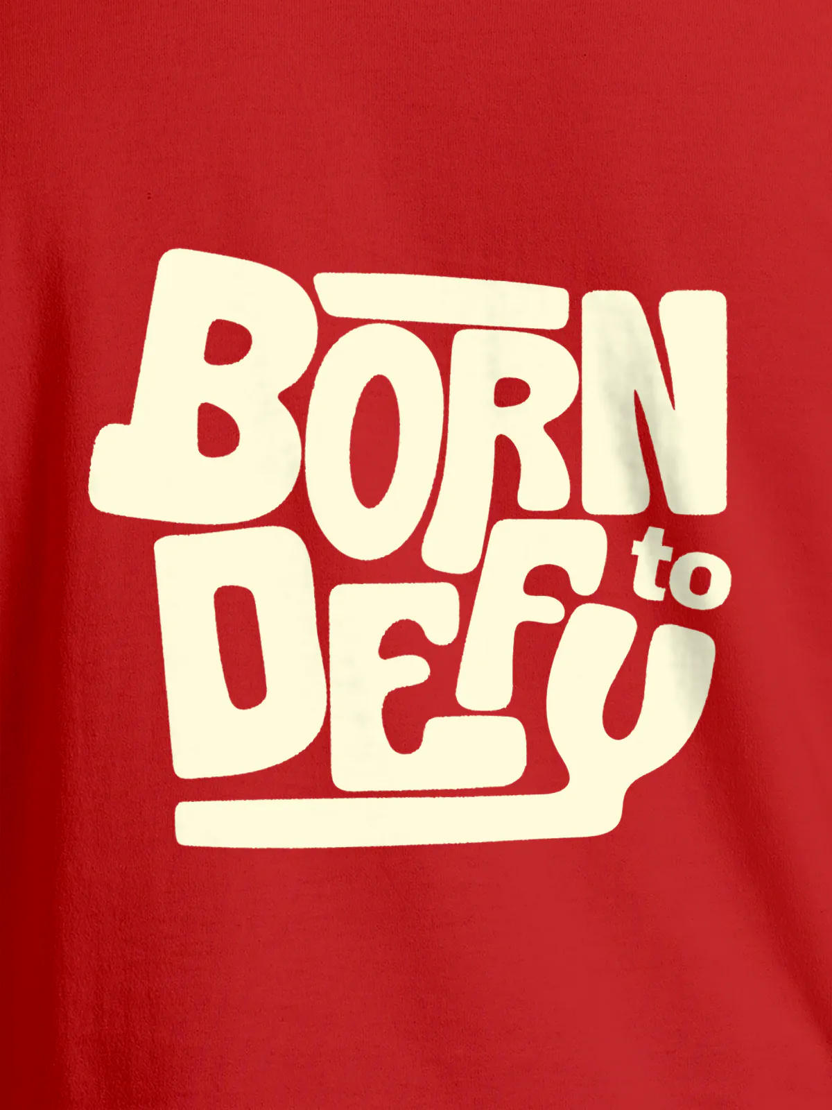 Close up of 'Born To Defy' design on Women's Red Round Neck T-shirt, highlighting intricate details and vibrant print.