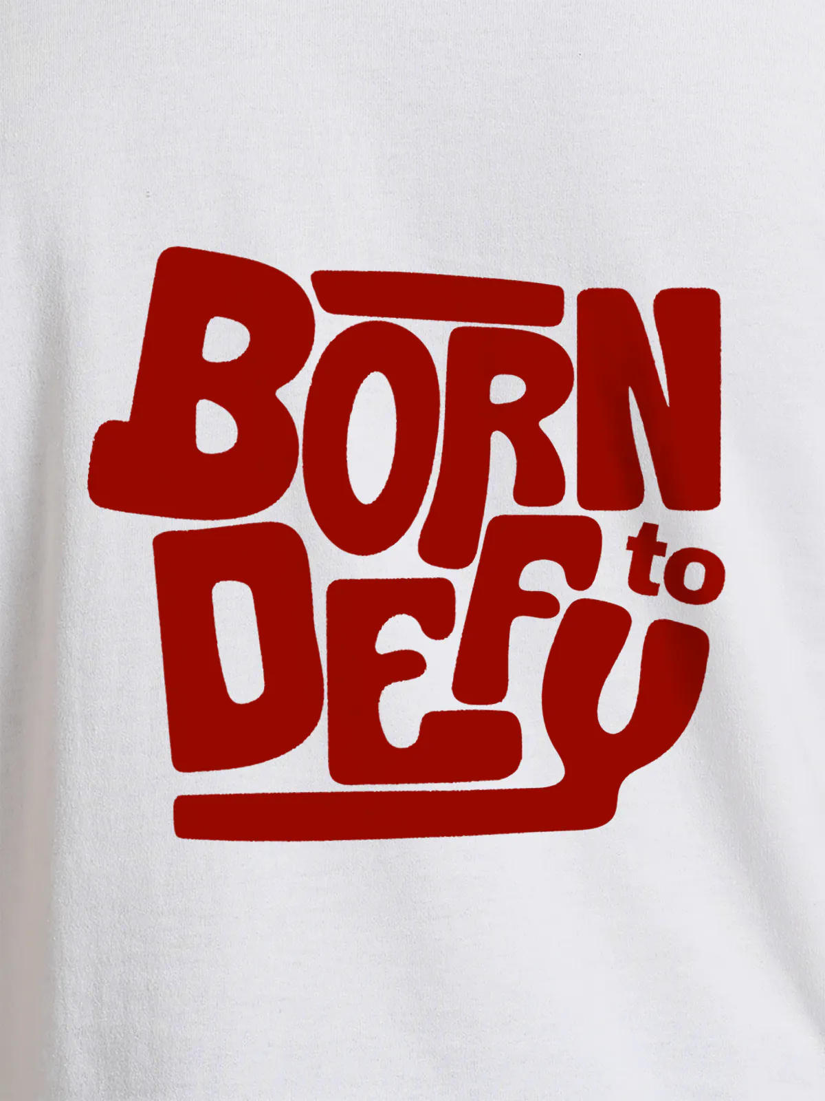 Close up of 'Born To Defy' design on Women's White Round Neck T-shirt, highlighting intricate details and vibrant print.