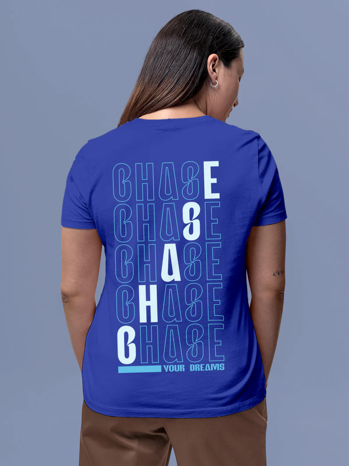 Model wearing Women's Blue Round Neck T-shirt with 'Chase Your Dreams' design, offering effortless style and premium comfort