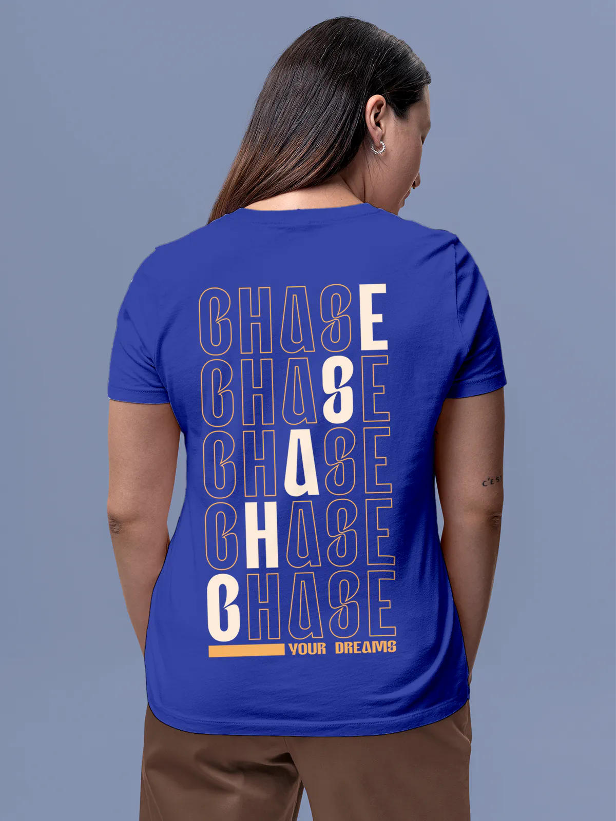 Model wearing Women's Blue Round Neck T-shirt with 'Chase Your Dreams' design, offering effortless style and premium comfort
