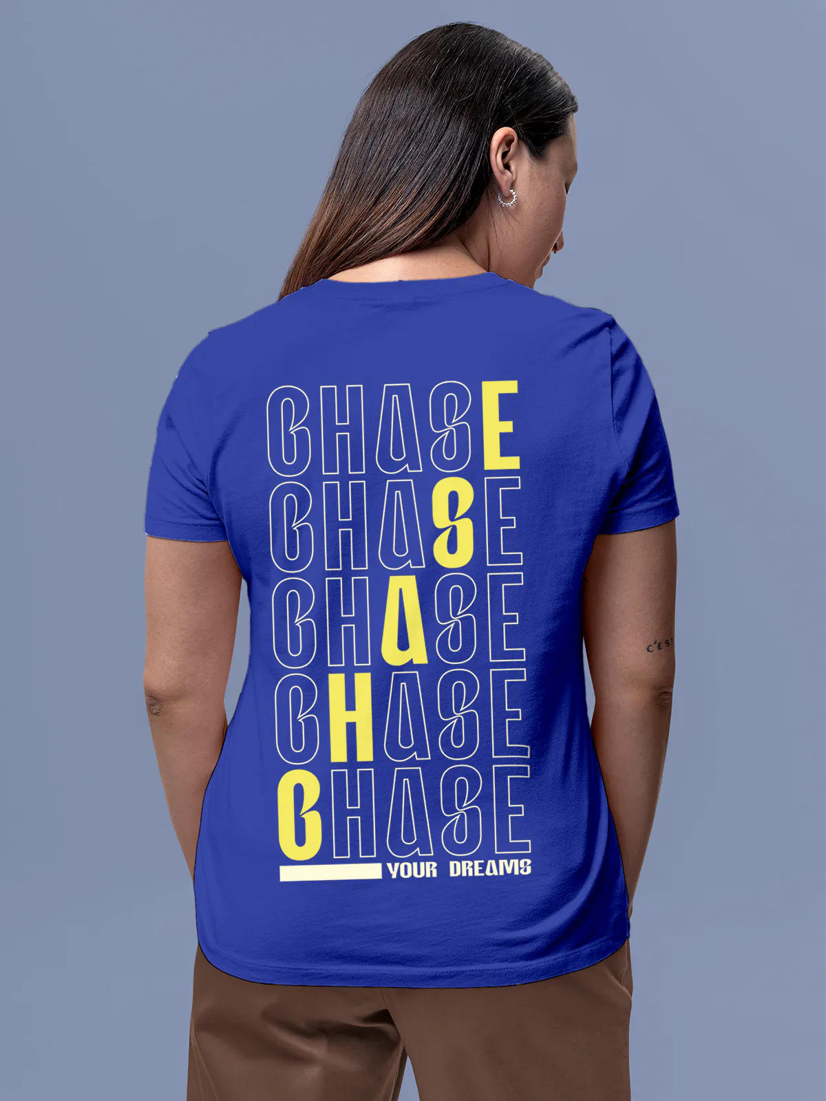 Model wearing Women's Blue Round Neck T-shirt with 'Chase Your Dreams' design, offering effortless style and premium comfort