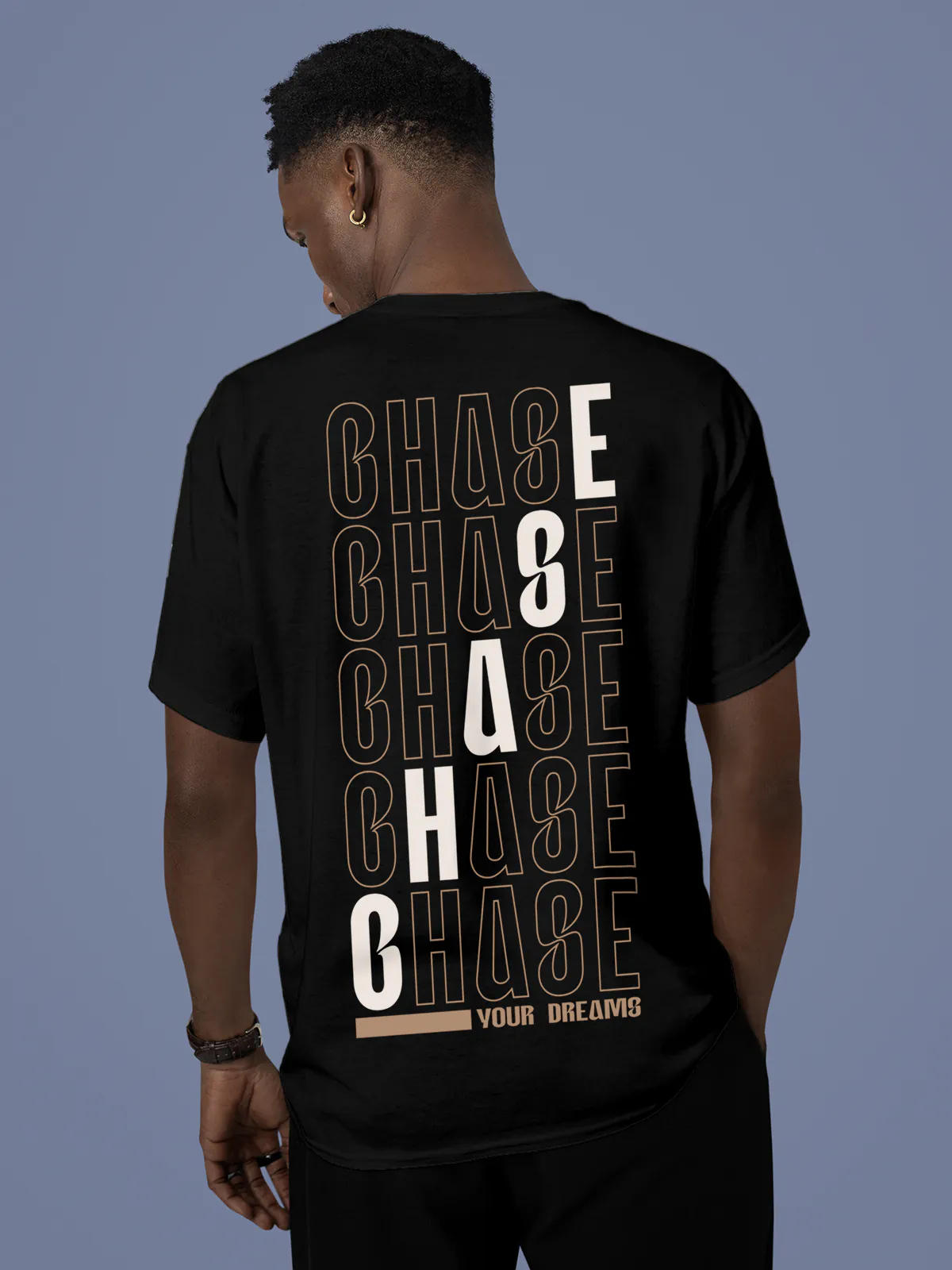 Model wearing Men's Black Round Neck T-shirt with 'Chase Your Dreams' design, offering effortless style and premium comfort